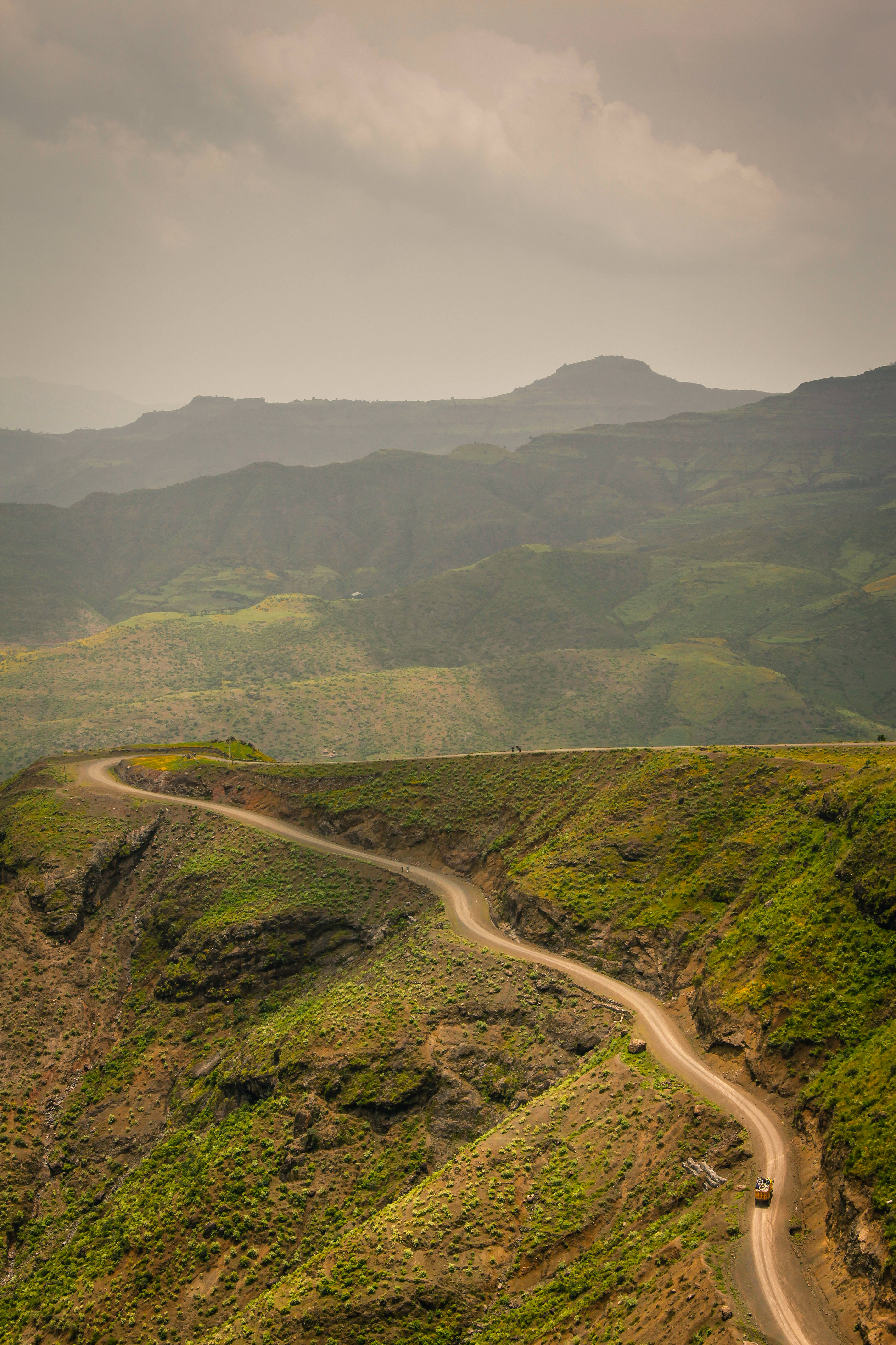 Ethiopia, green mountain road, winding dirt road, 5K Phone Wallpaper