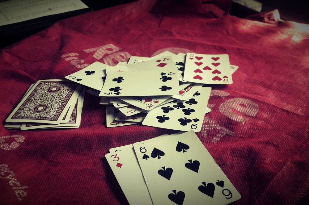 Euchre, playing cards, textured red fabric, SD Desktop Wallpaper