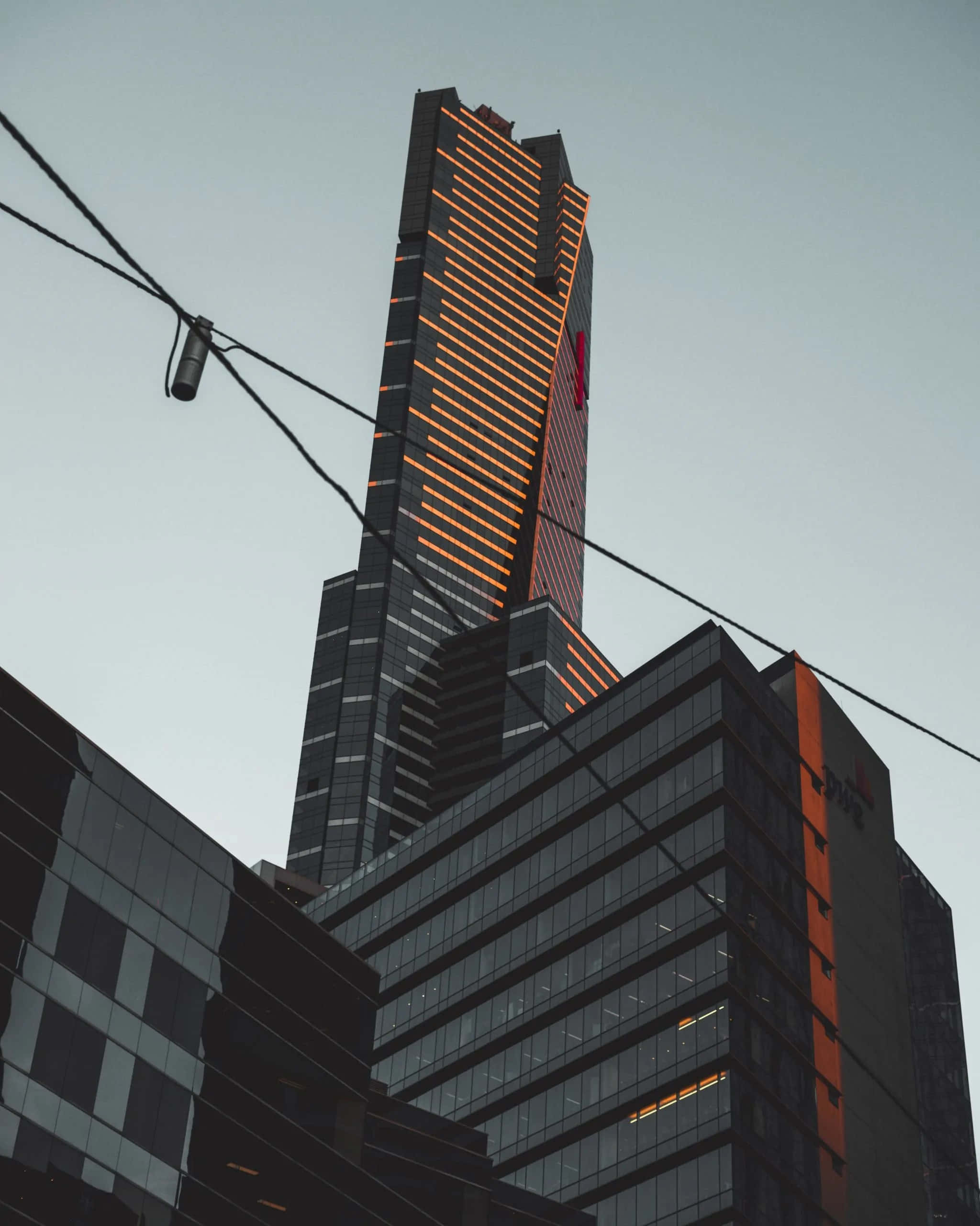 Eureka Tower, dusk lights, glowing orange horizontal lights, 2K Phone Wallpaper