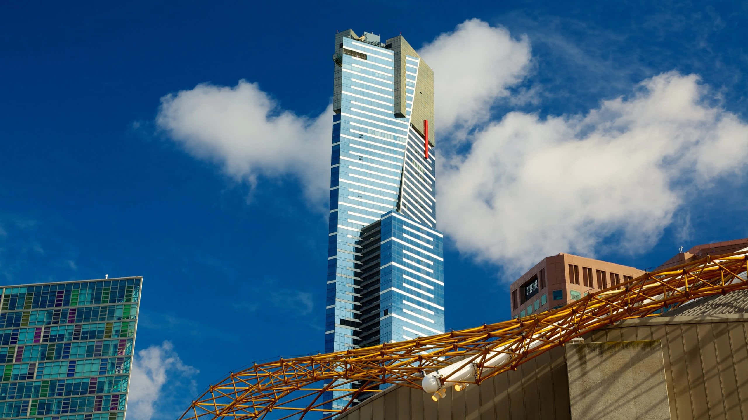 Eureka Tower, red vertical stripe, vibrant blue sky, 2K Desktop Wallpaper