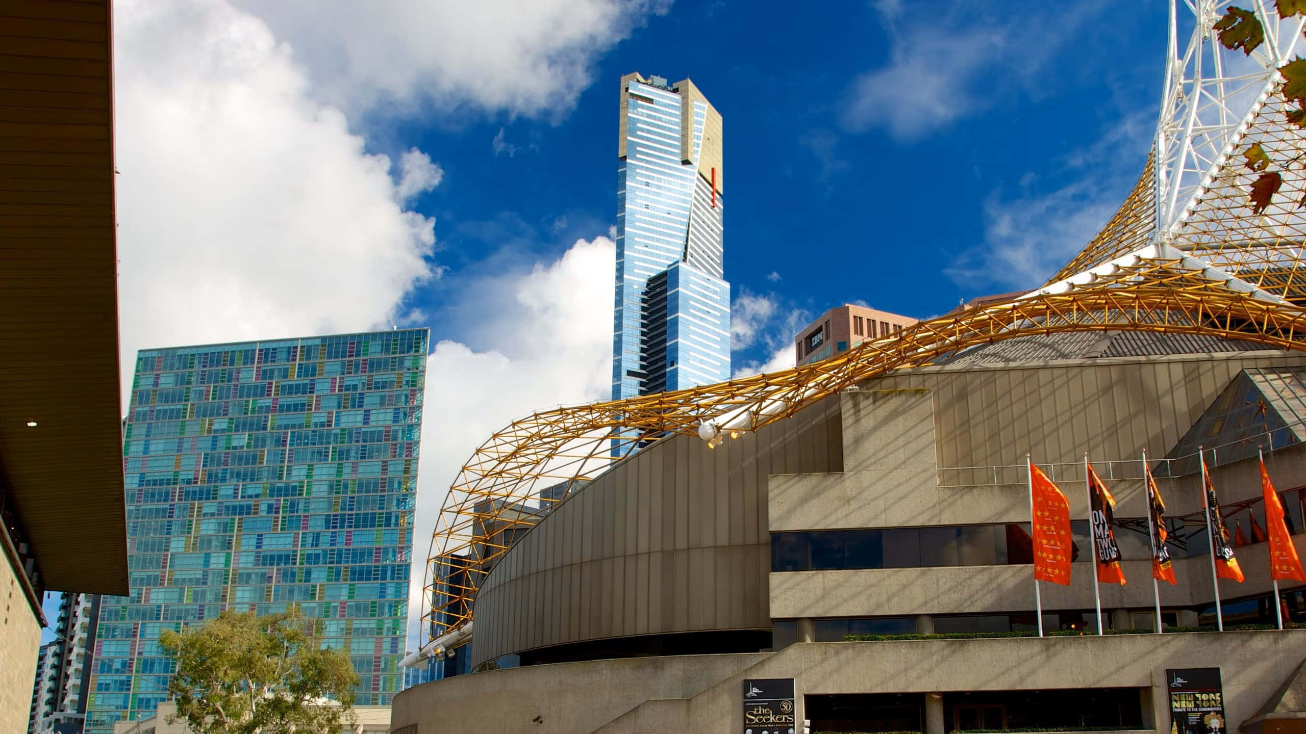 Eureka Tower, glass skyscraper, golden arched structure, 2K Desktop Wallpaper