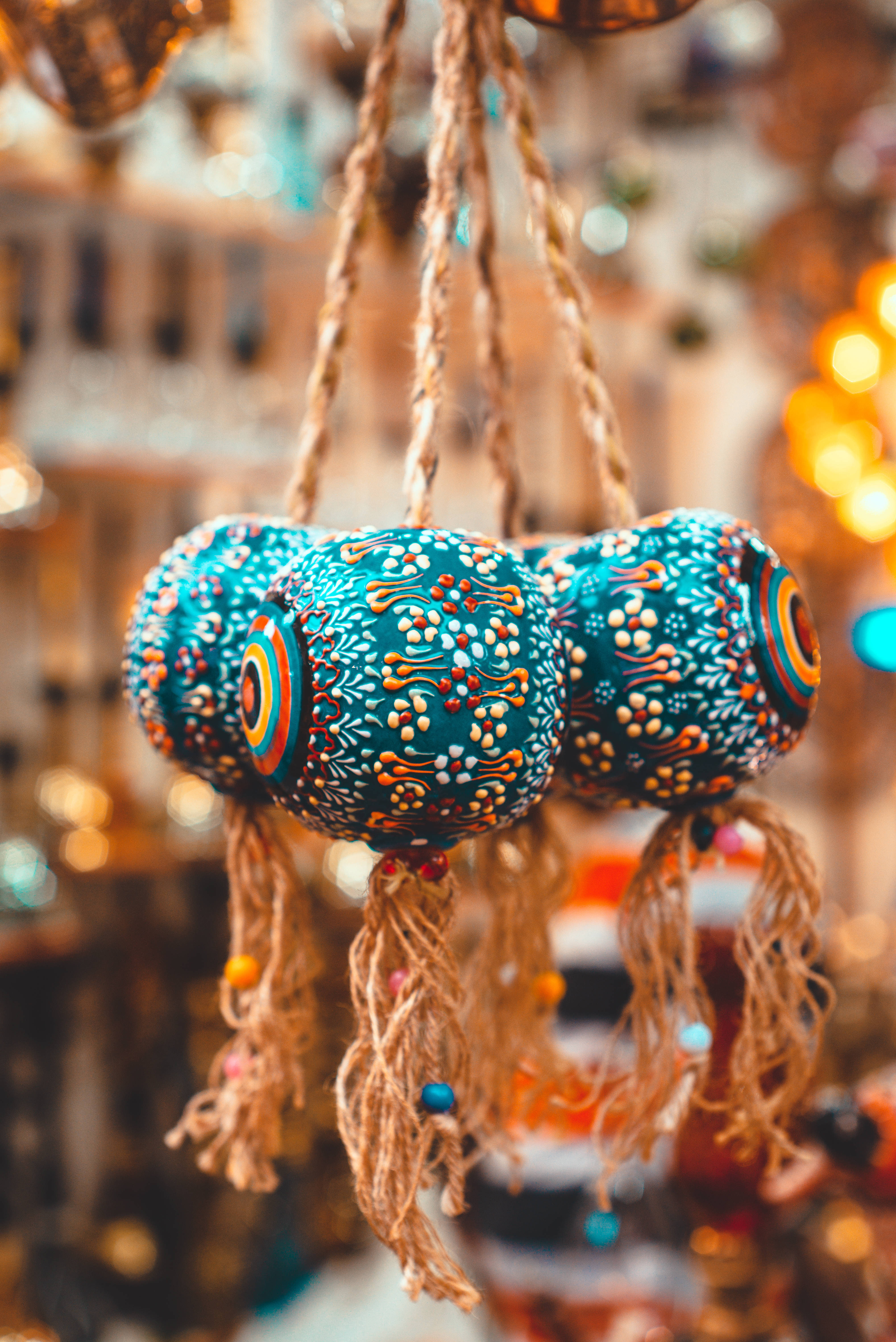 blue hanging evil eyes, teal ceramic ornaments, twine, 5K Phone Wallpaper