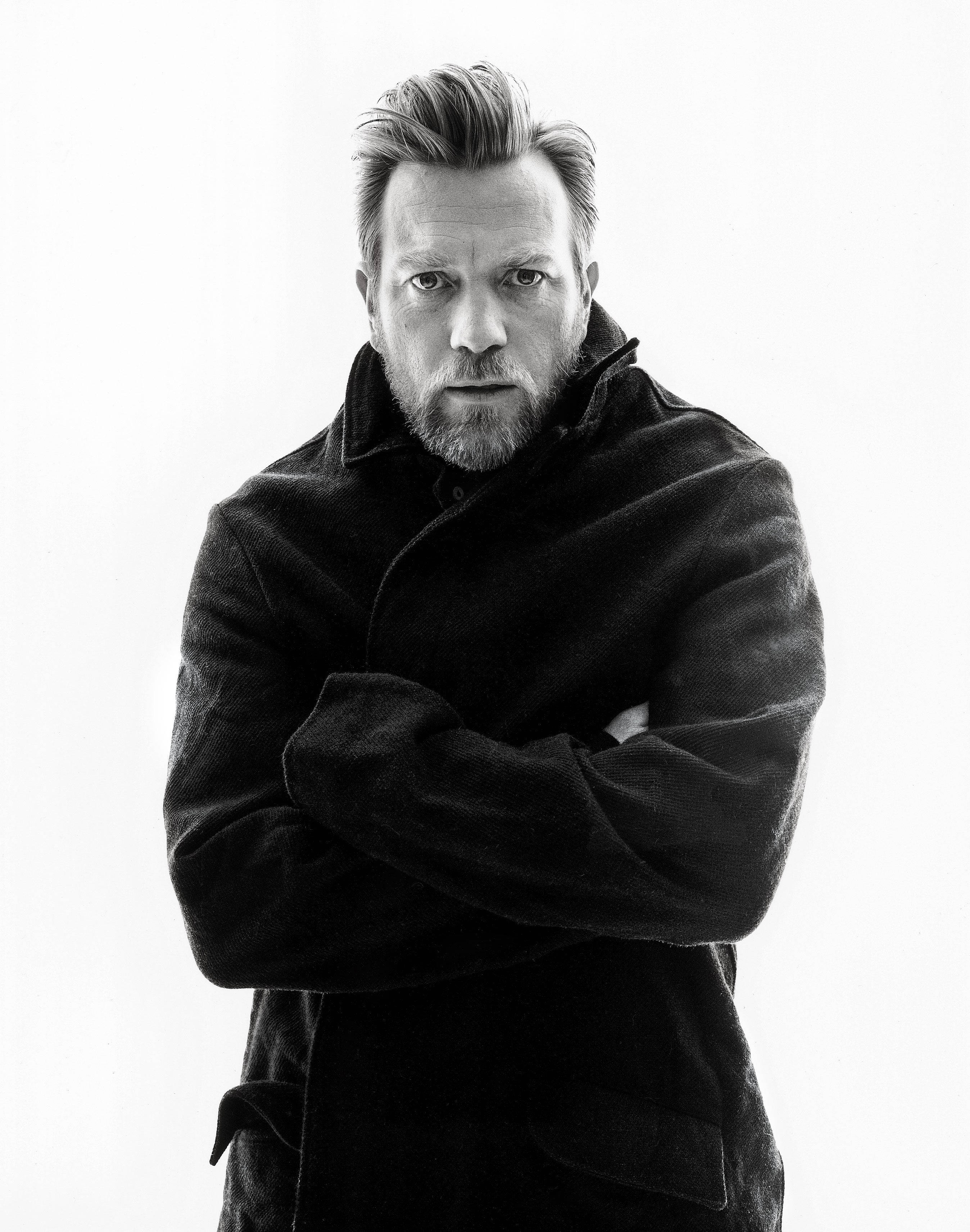 Ewan McGregor, black coat, stark white background, 2K Phone Wallpaper