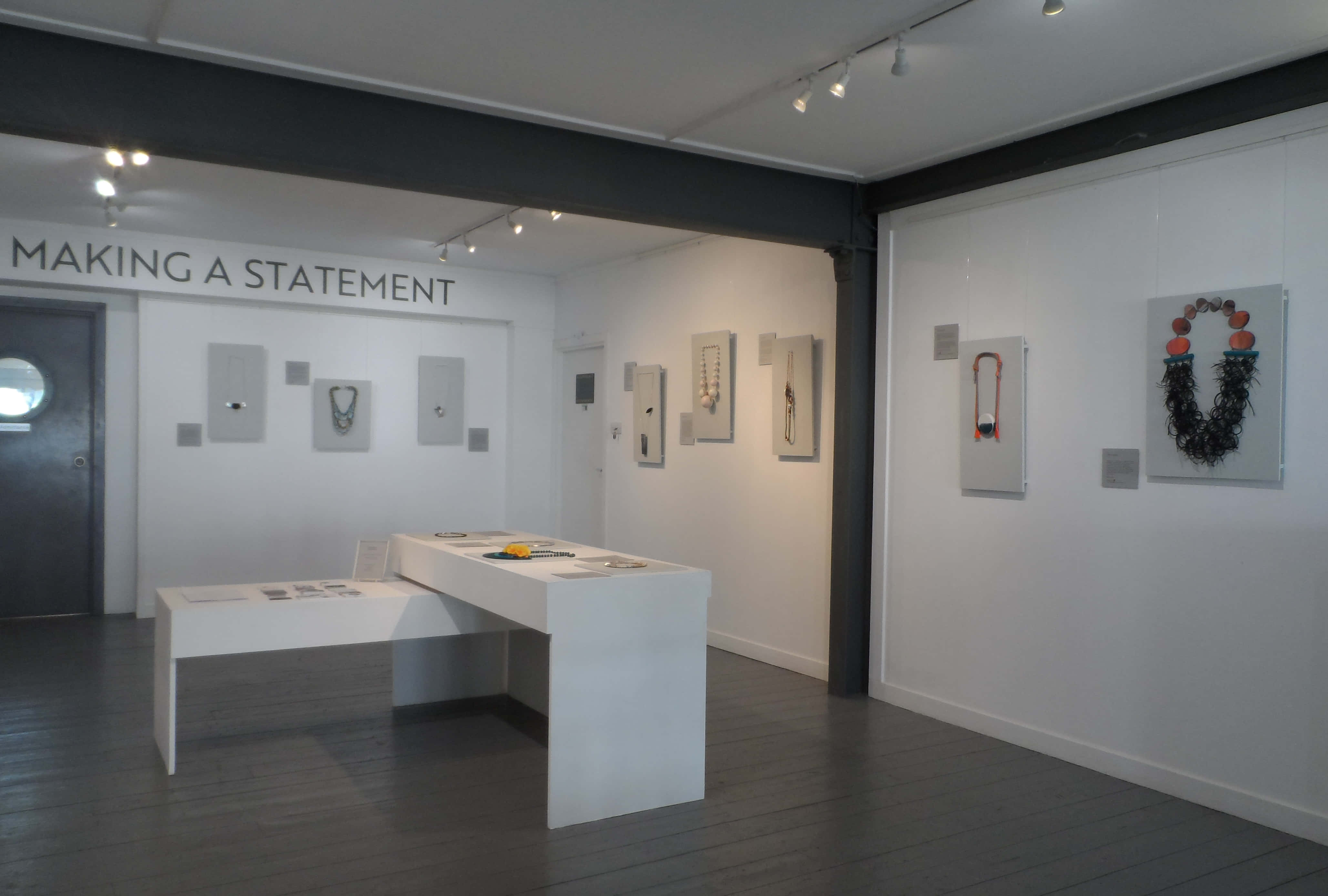Exhibition, white walls, framed jewelry pieces, 4K Desktop Wallpaper