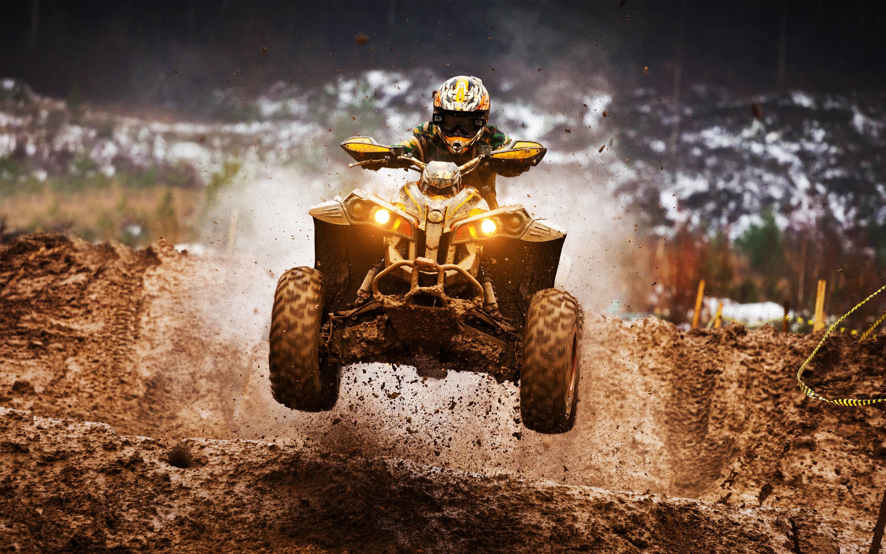 yellow ATV, headlights blazing, muddy hill, 2K Desktop Wallpaper