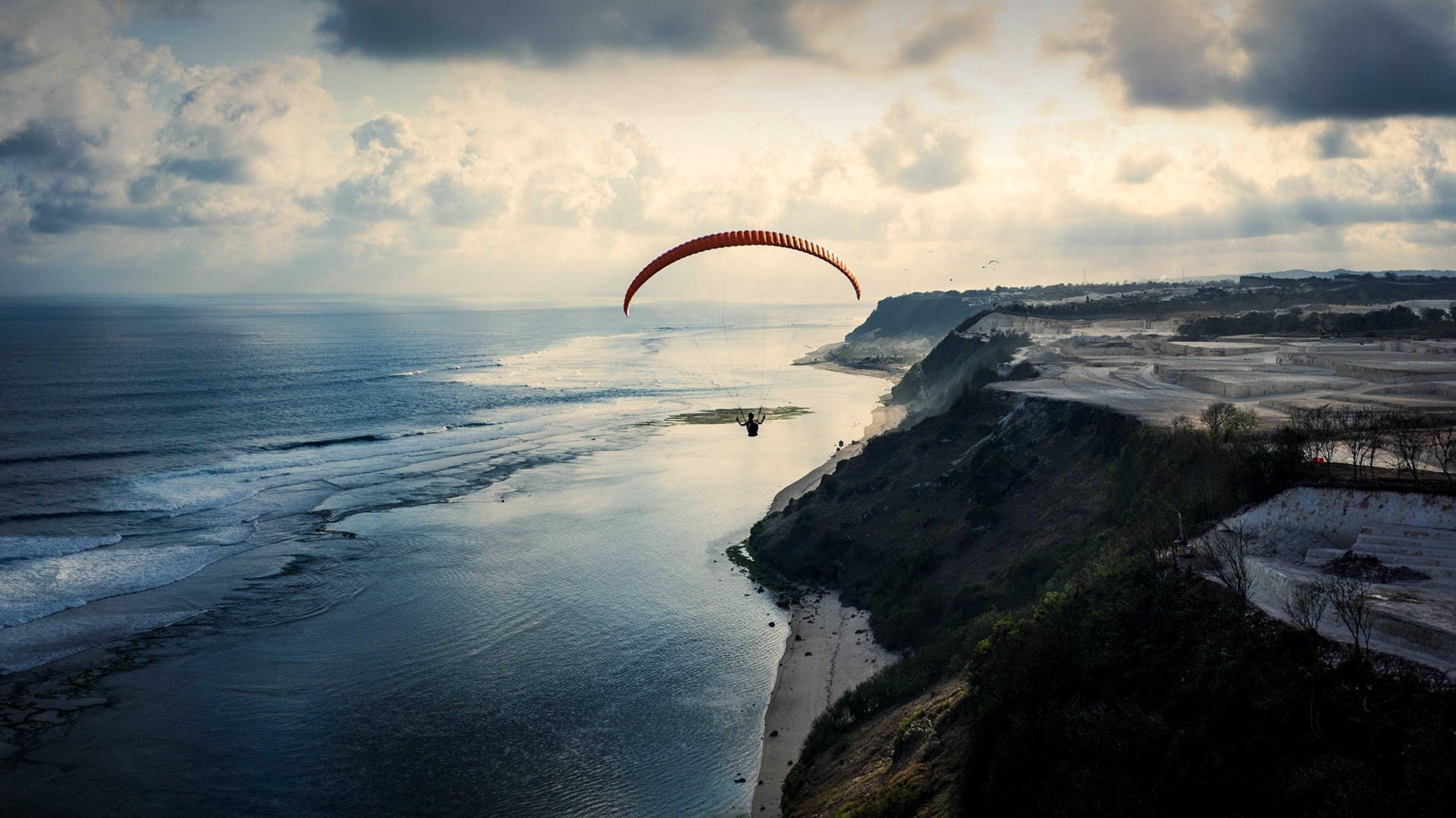 paragliding, sea cliffs, red canopy, 5K Desktop Wallpaper