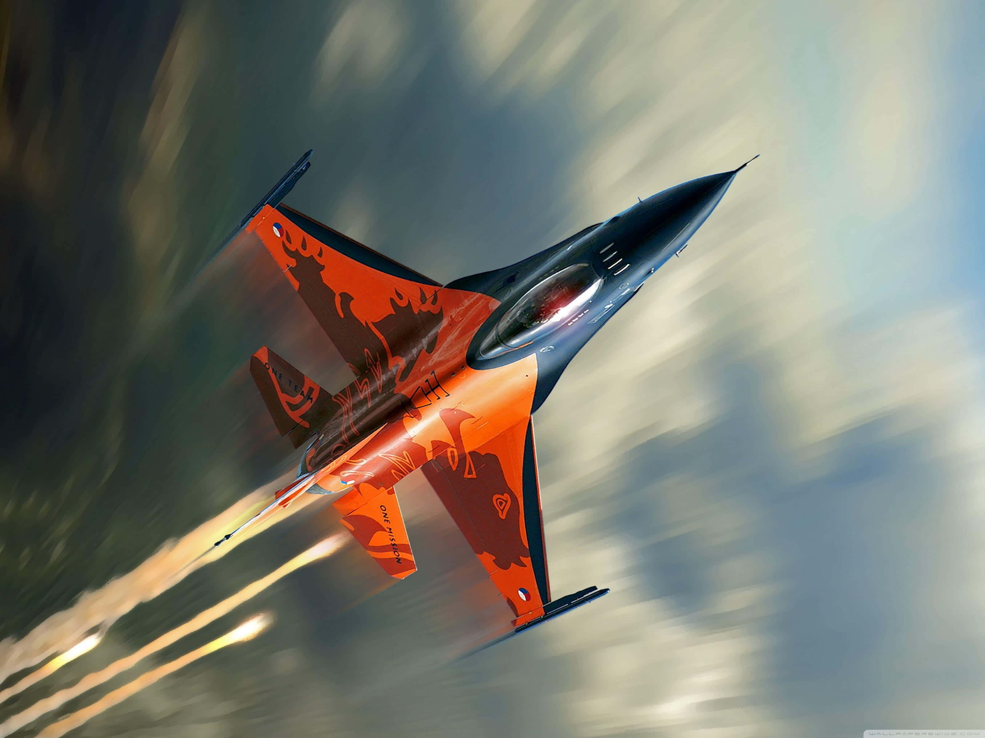 F-16, orange and black, cloudy skies, 2K Desktop Wallpaper