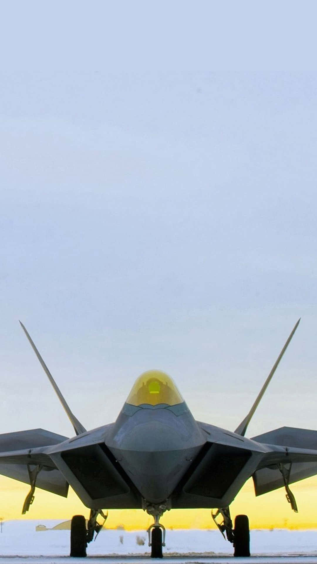 F 22 Raptor, sleek gray fighter jet, glowing yellow canopy, Full HD Phone Wallpaper