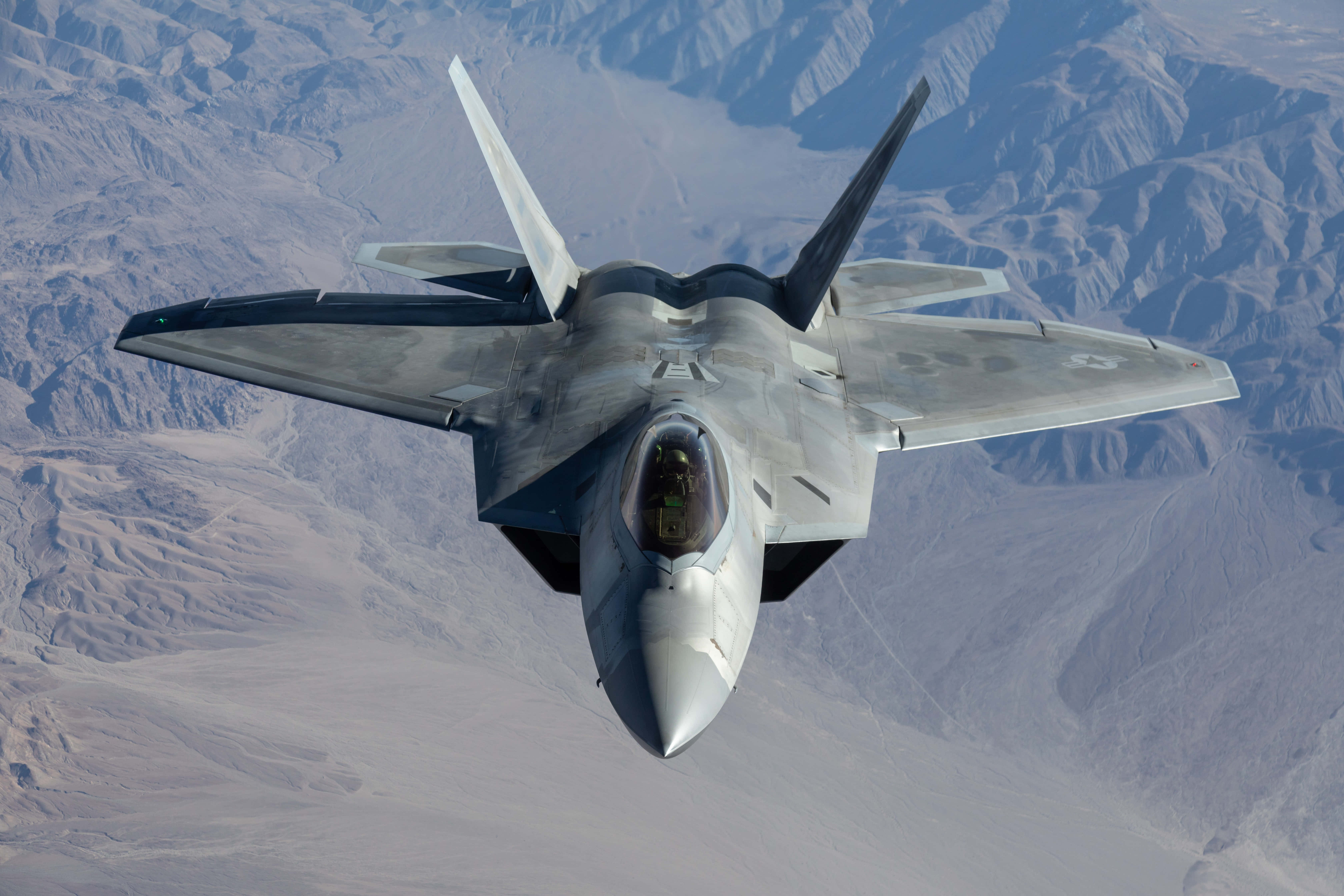 F 22 Raptor, gray, rugged desert mountains, 5K Desktop Wallpaper