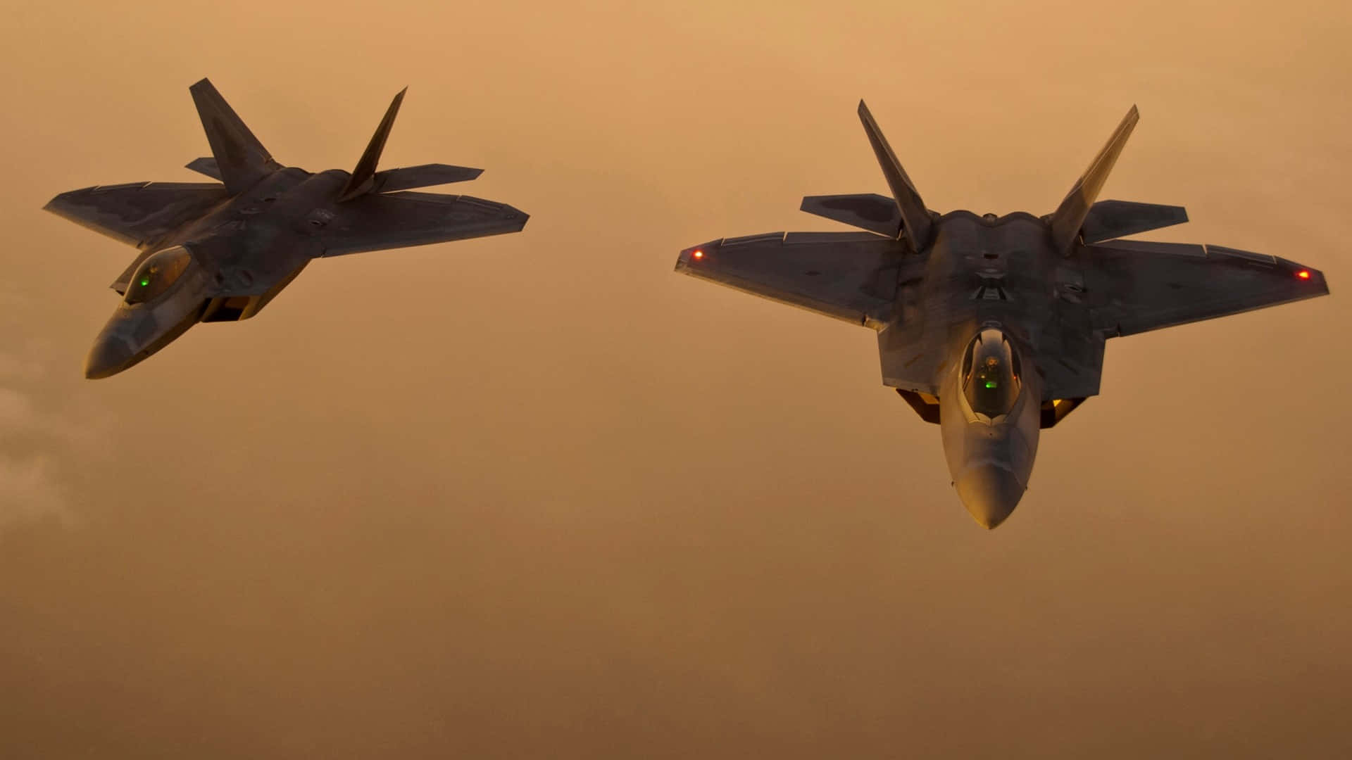 F 22 Raptor, glowing orange sunset, cockpit lights, Full HD Desktop Wallpaper