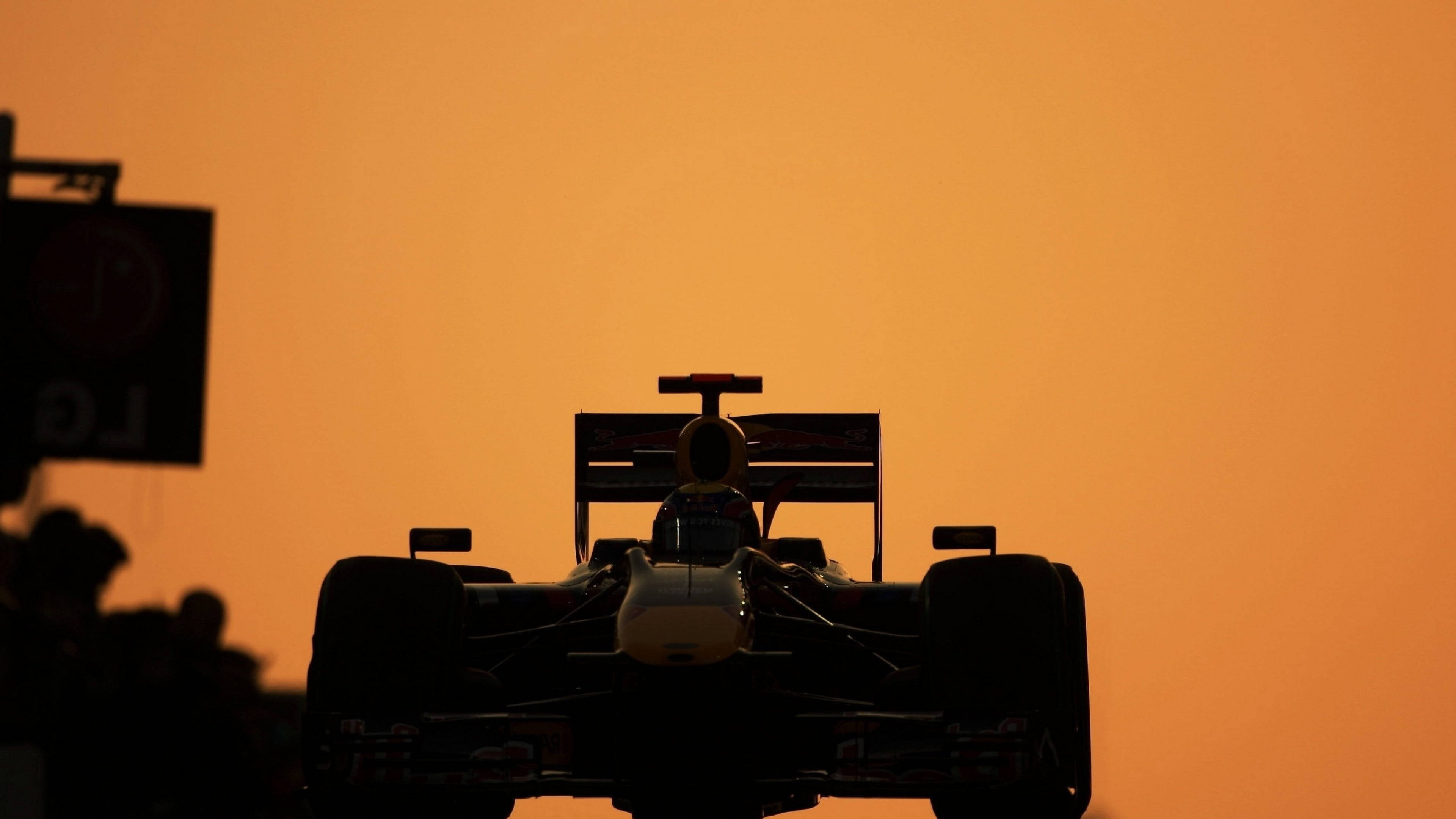 F1 racing car, Formula 1 race car, vibrant orange sunset sky, 4K Desktop Wallpaper