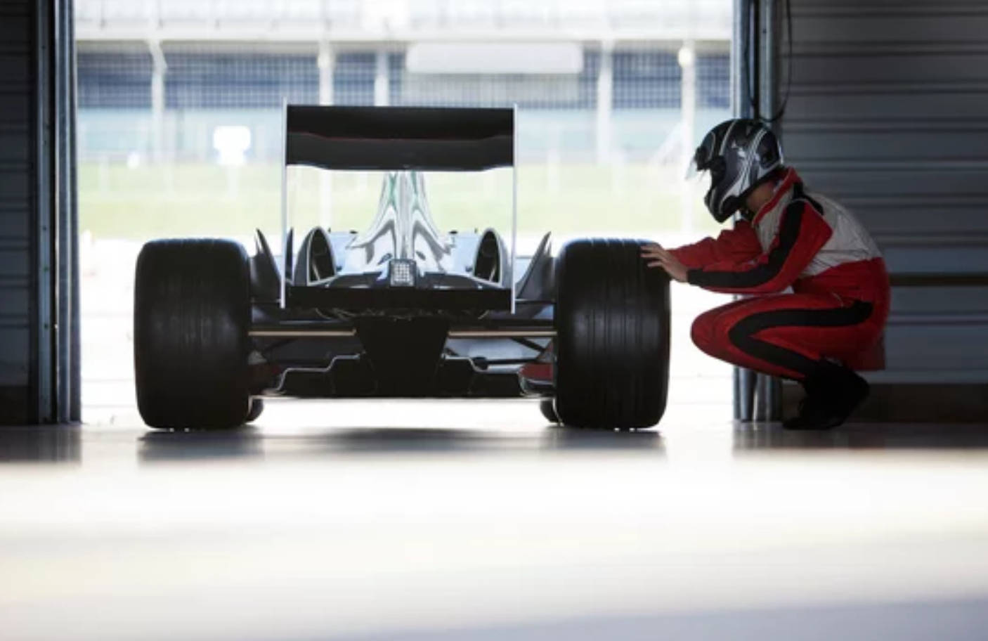 F1 4K, red suit, sleek black formula one car, HD Desktop Wallpaper