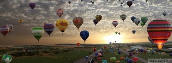 floating parachutes, hot air balloons, vast green field, SD Desktop Wallpaper