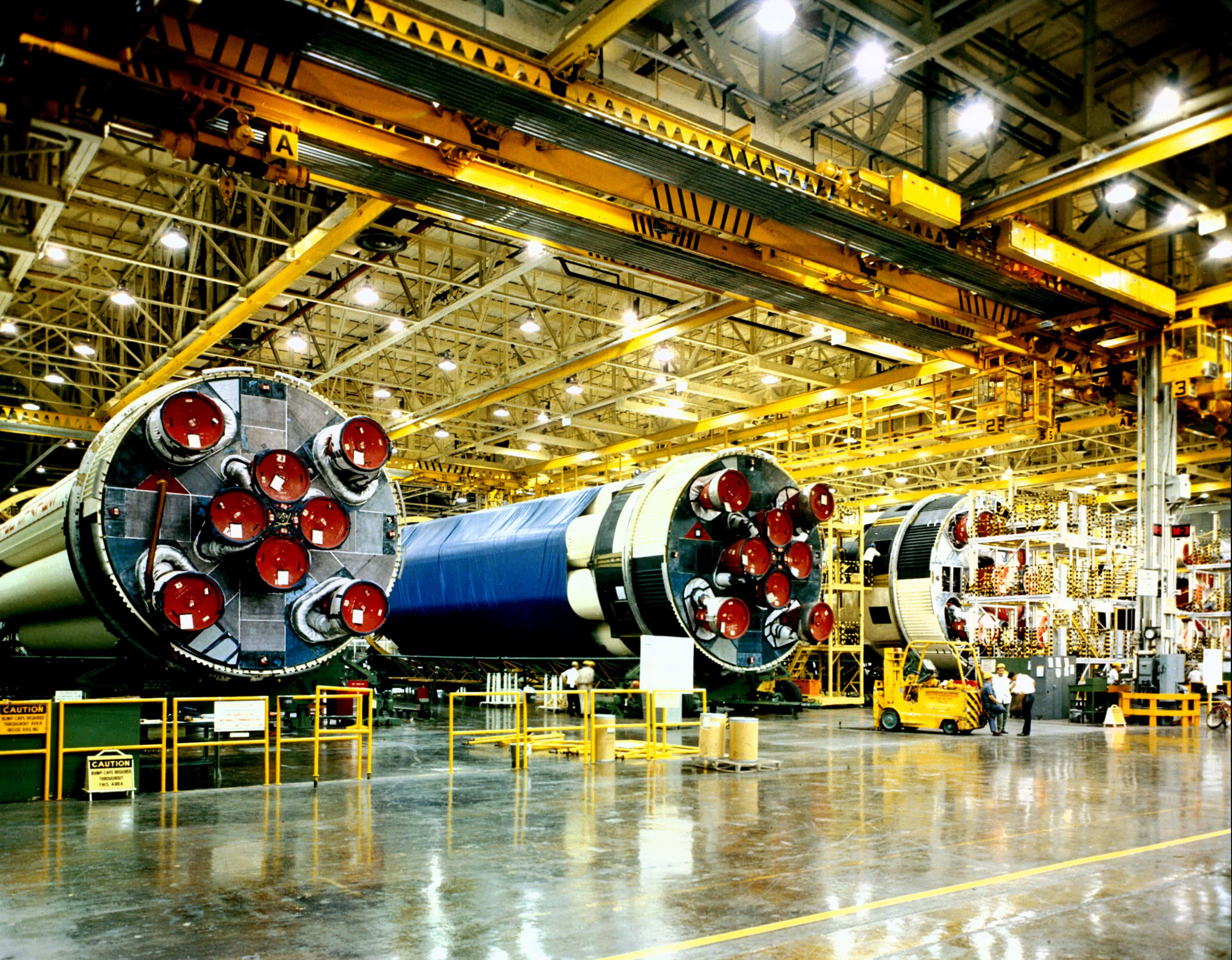 manufacturing facility, rocket boosters, red nozzles, 2K Desktop Wallpaper