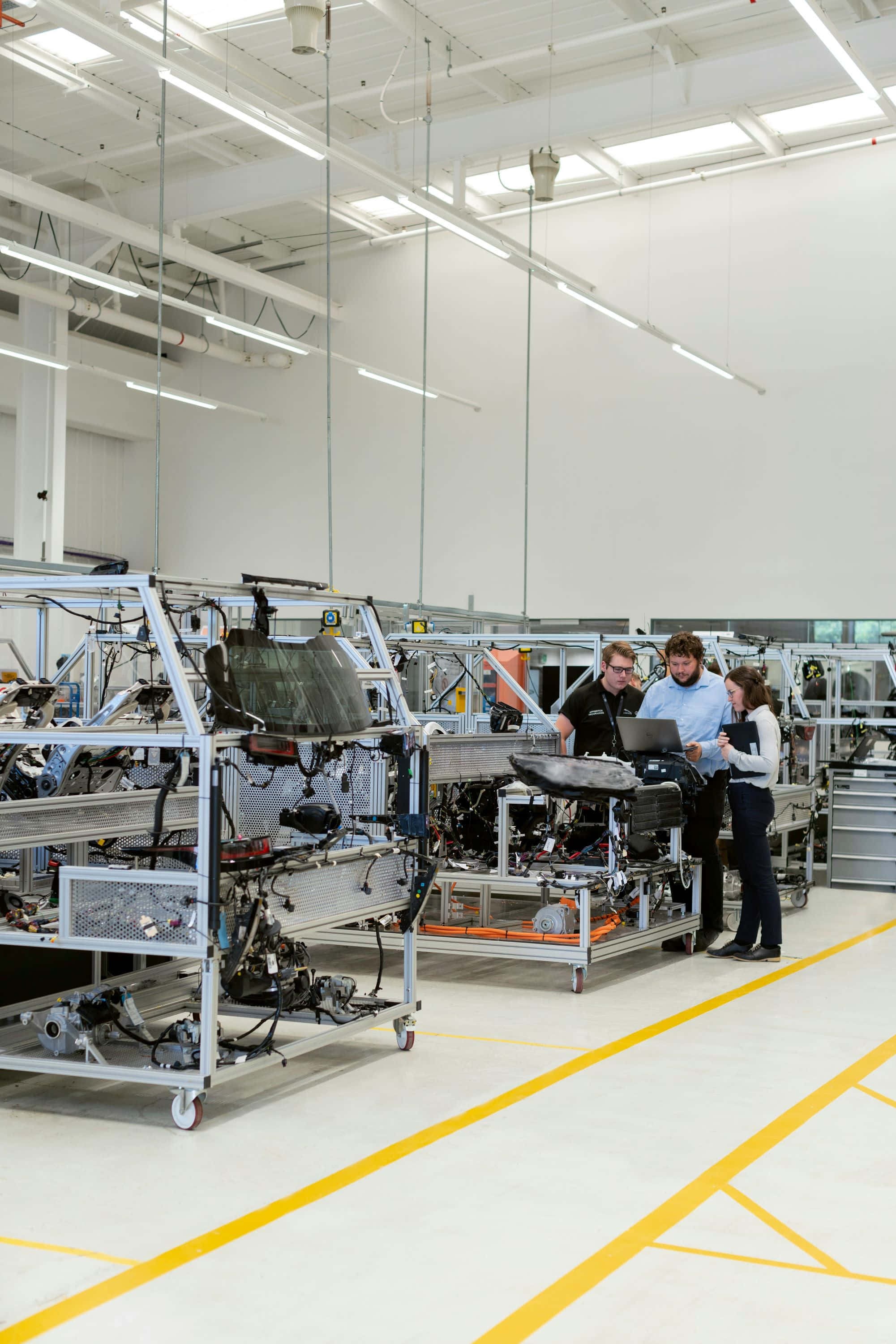 industrial team, modern factory, robotic assembly line, 2K Phone Wallpaper