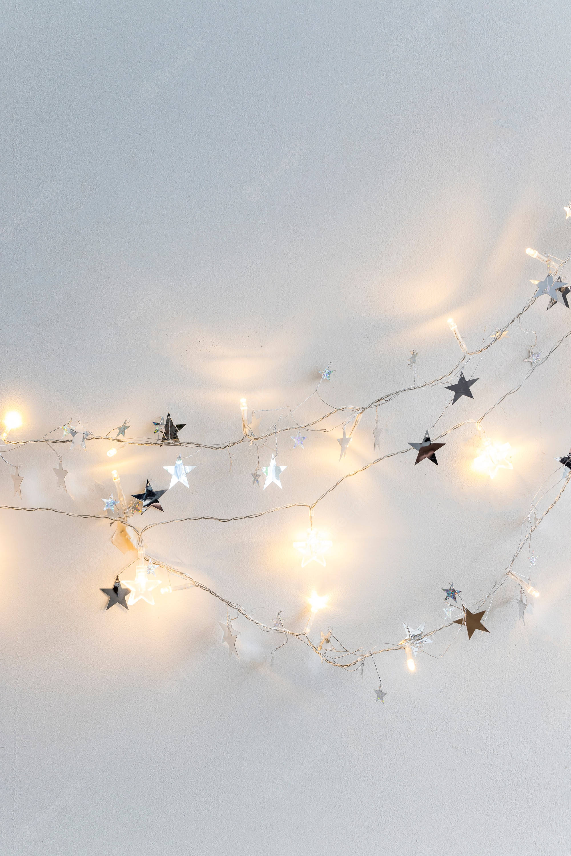 fairy lights, star-shaped string lights, warm glowing, 2K Phone Wallpaper