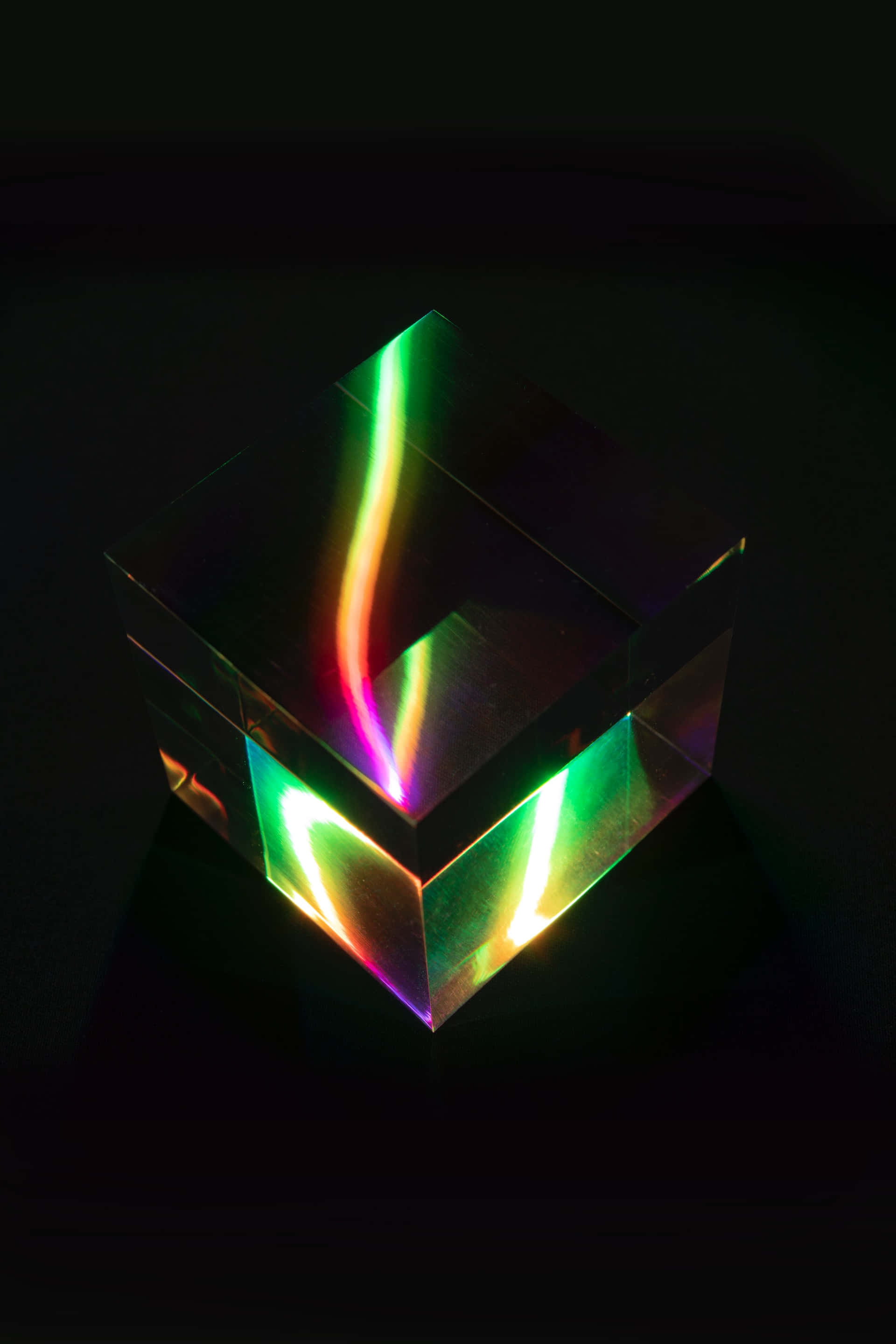 transparent glass cube, vibrant rainbow light, glowing streaks, 2K Phone Wallpaper