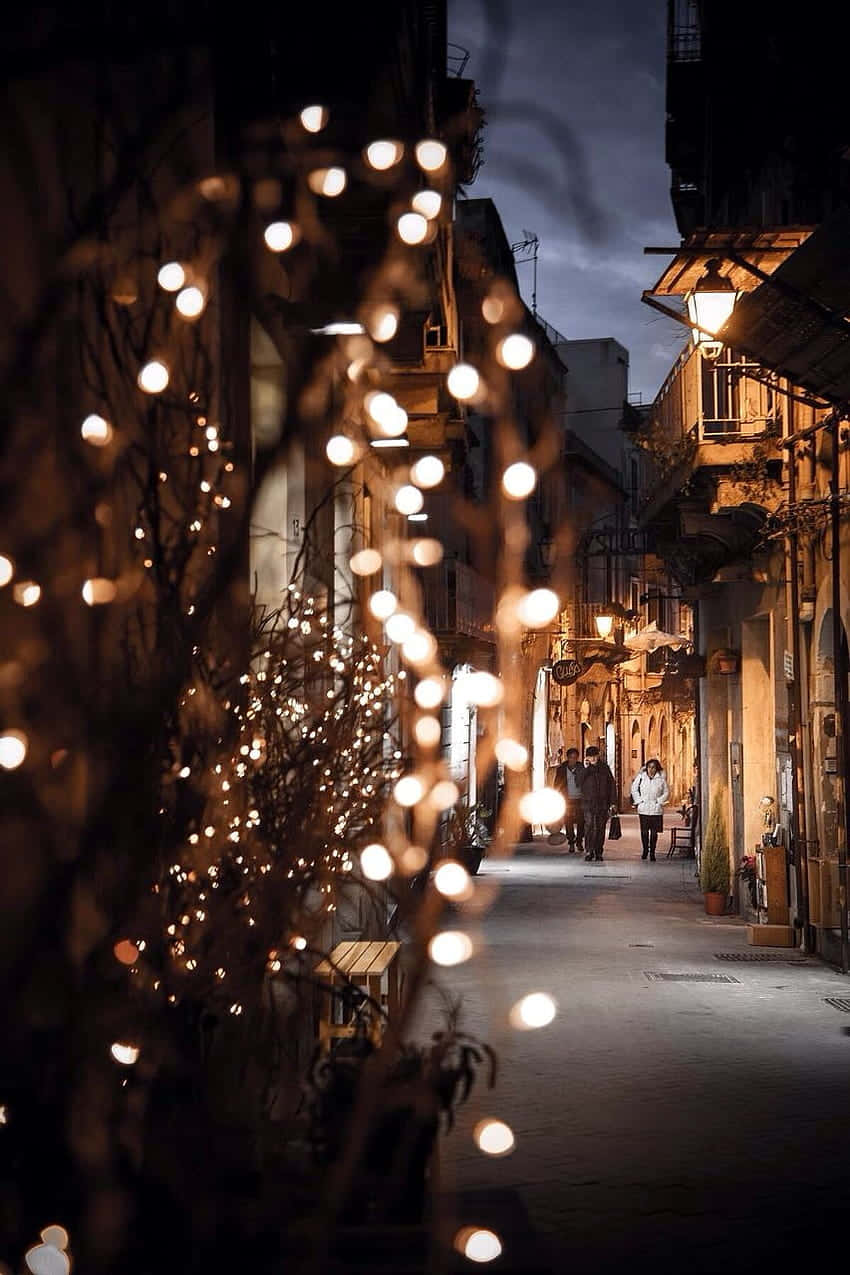 pink fairy lights, cobblestone alley, night, SD Phone Wallpaper