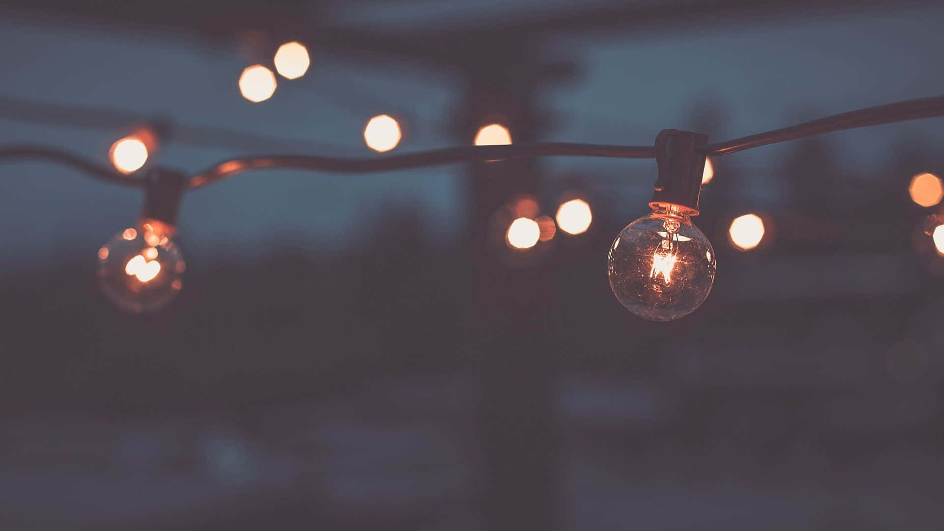 Fall Aesthetic Macbook, warm glowing string lights, dusky twilight sky, Full HD Desktop Wallpaper