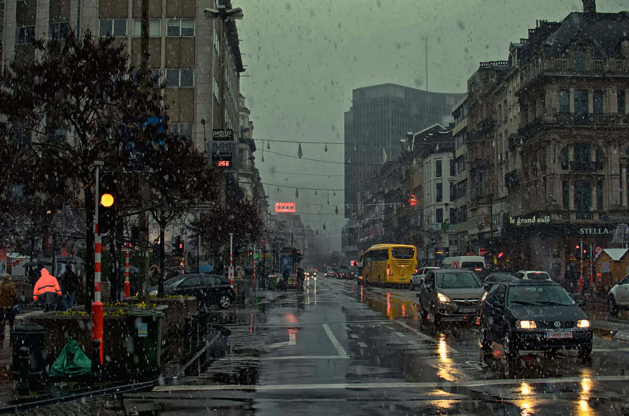 Rain-slicked city street, dusk, glowing traffic lights, Full HD Desktop Wallpaper