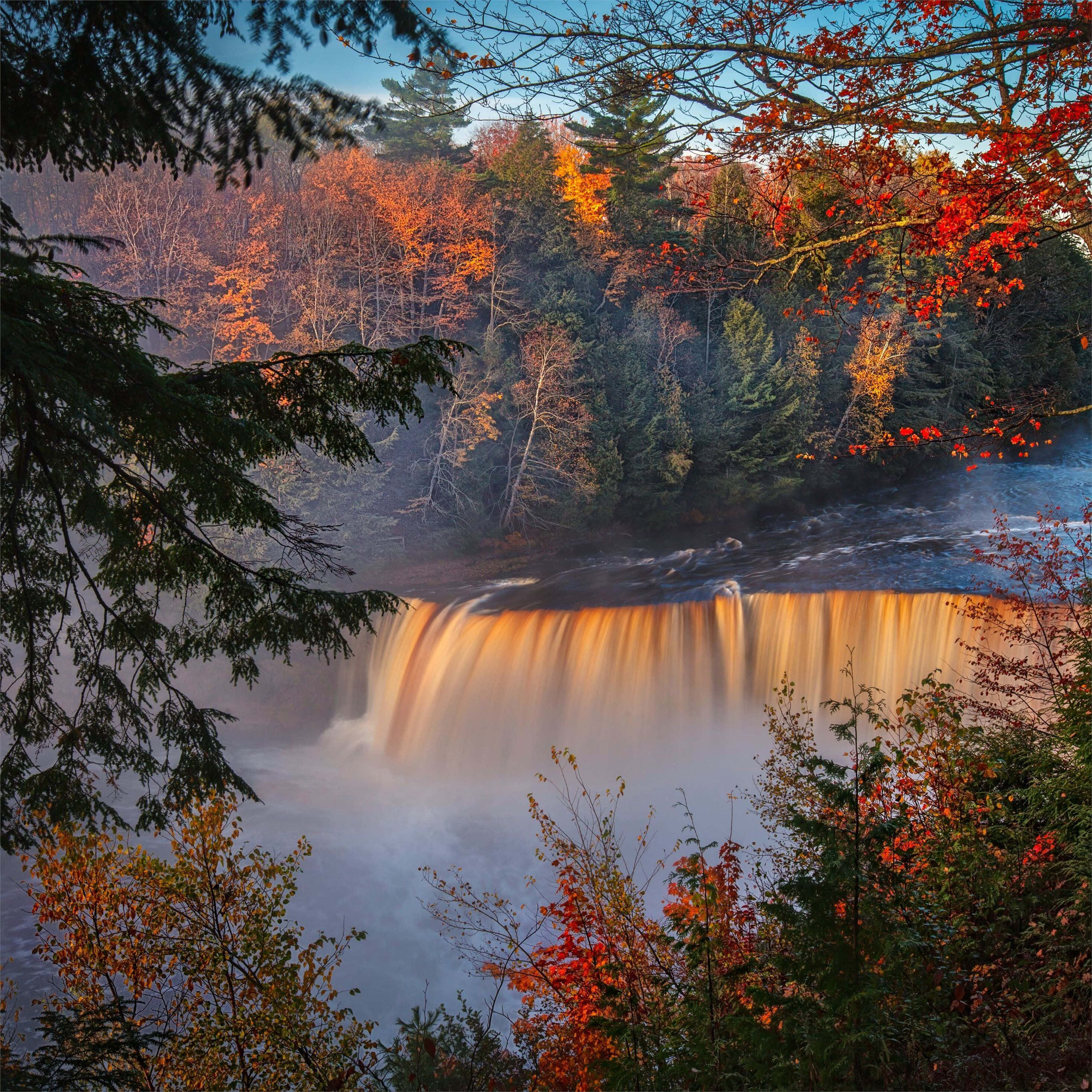 Fall River, autumn waterfall, vibrant red and orange foliage, 2K Desktop Wallpaper