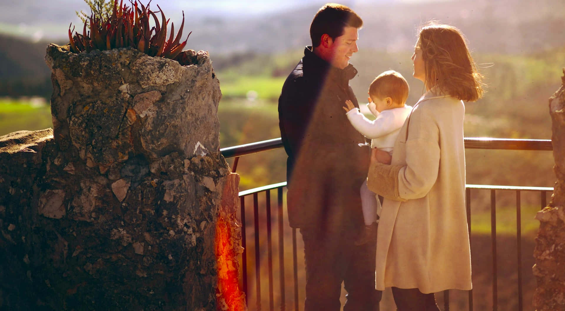 family of three, sunlit balcony, rolling hills, Full HD Desktop Wallpaper