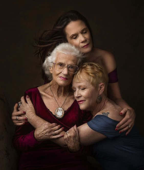 Family Portrait, three generations of women, dimly lit studio portrait, SD Phone Wallpaper