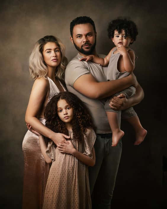 family of four, textured brown backdrop, soft studio lighting, SD Phone Wallpaper