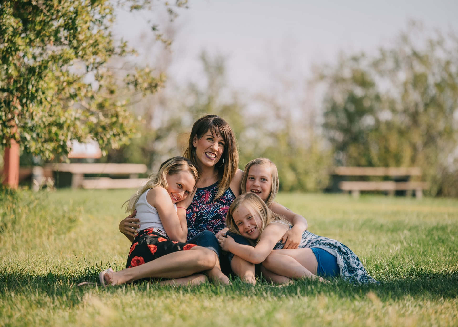 mother, three daughters, sunlit grass, Full HD Desktop Wallpaper