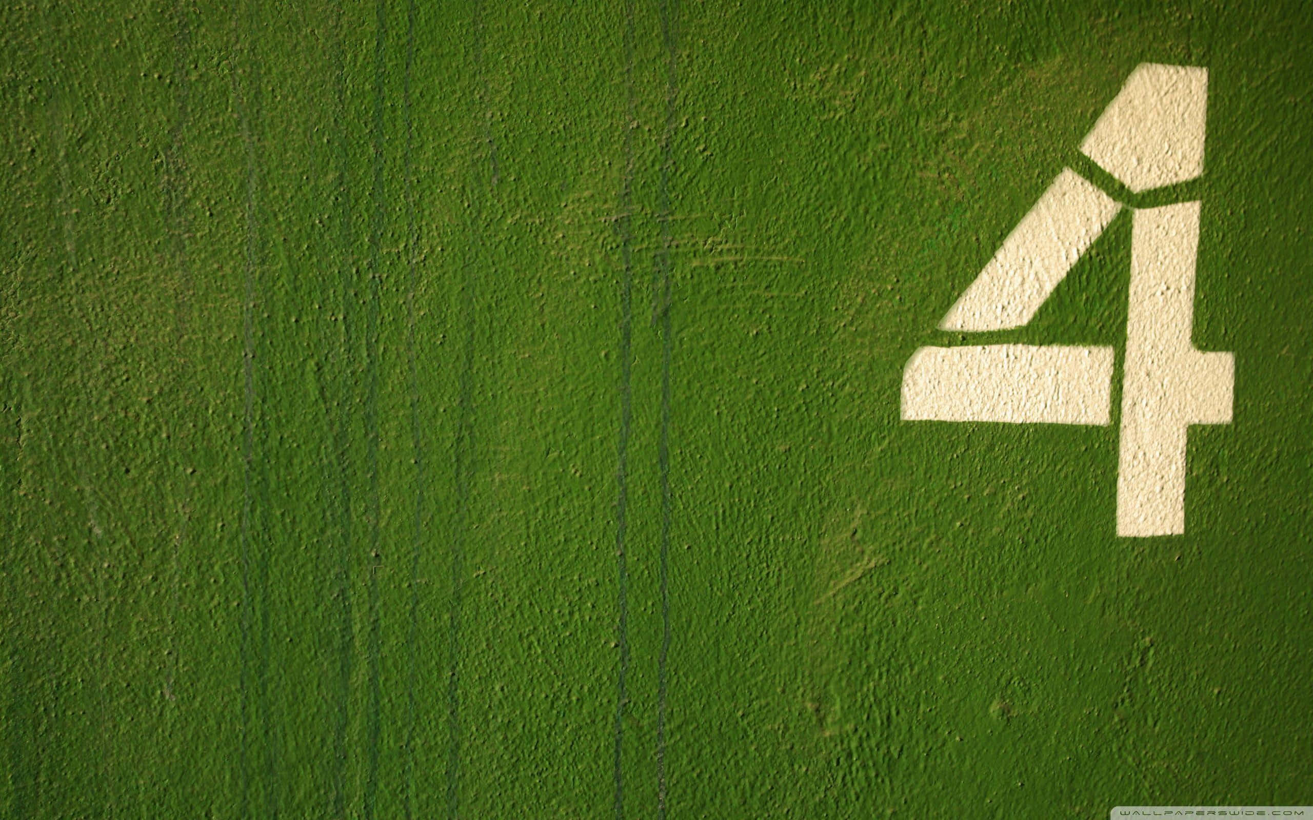 Fantastic Four, white number four, vibrant green grass, 2K Desktop Wallpaper