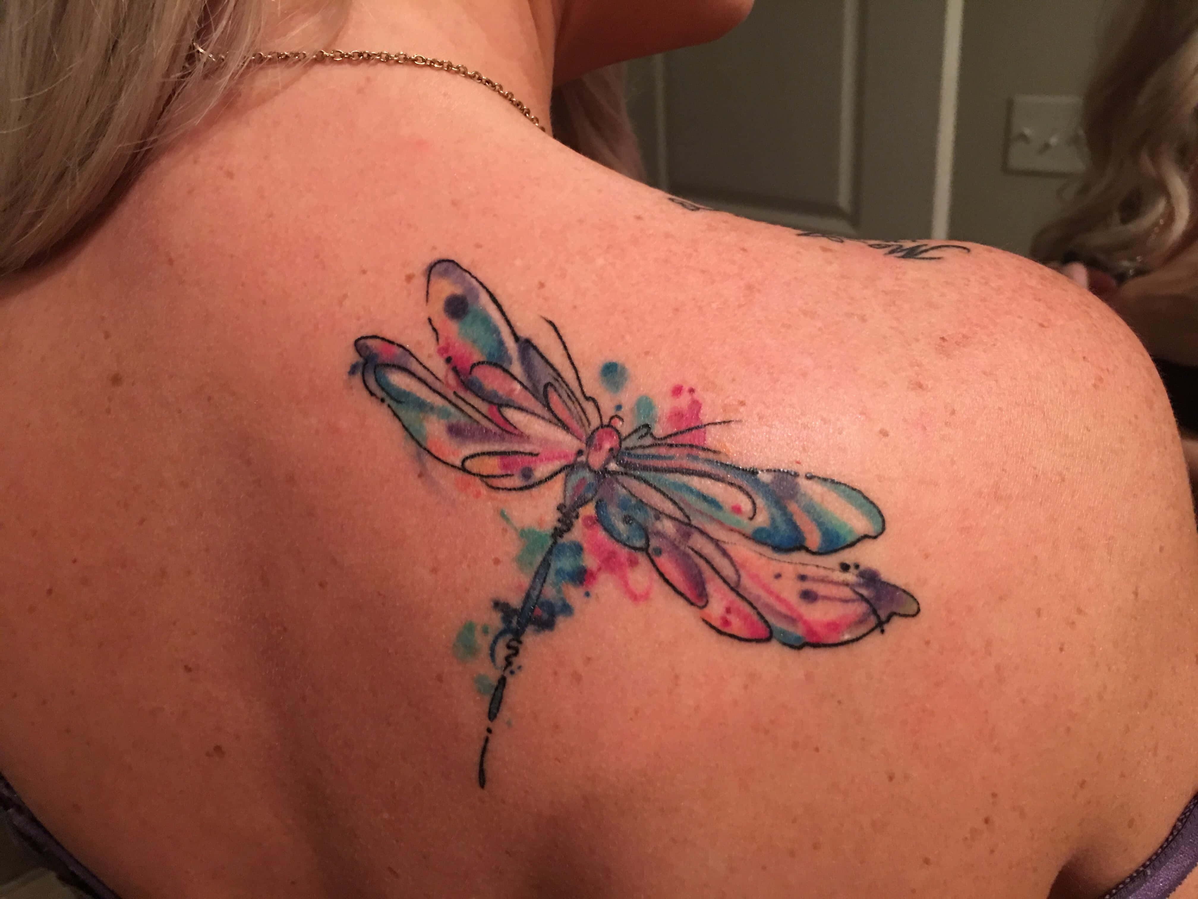 watercolor dragonfly tattoo, pink blue and teal hues, upper back near the shoulder blade, 4K Desktop Wallpaper