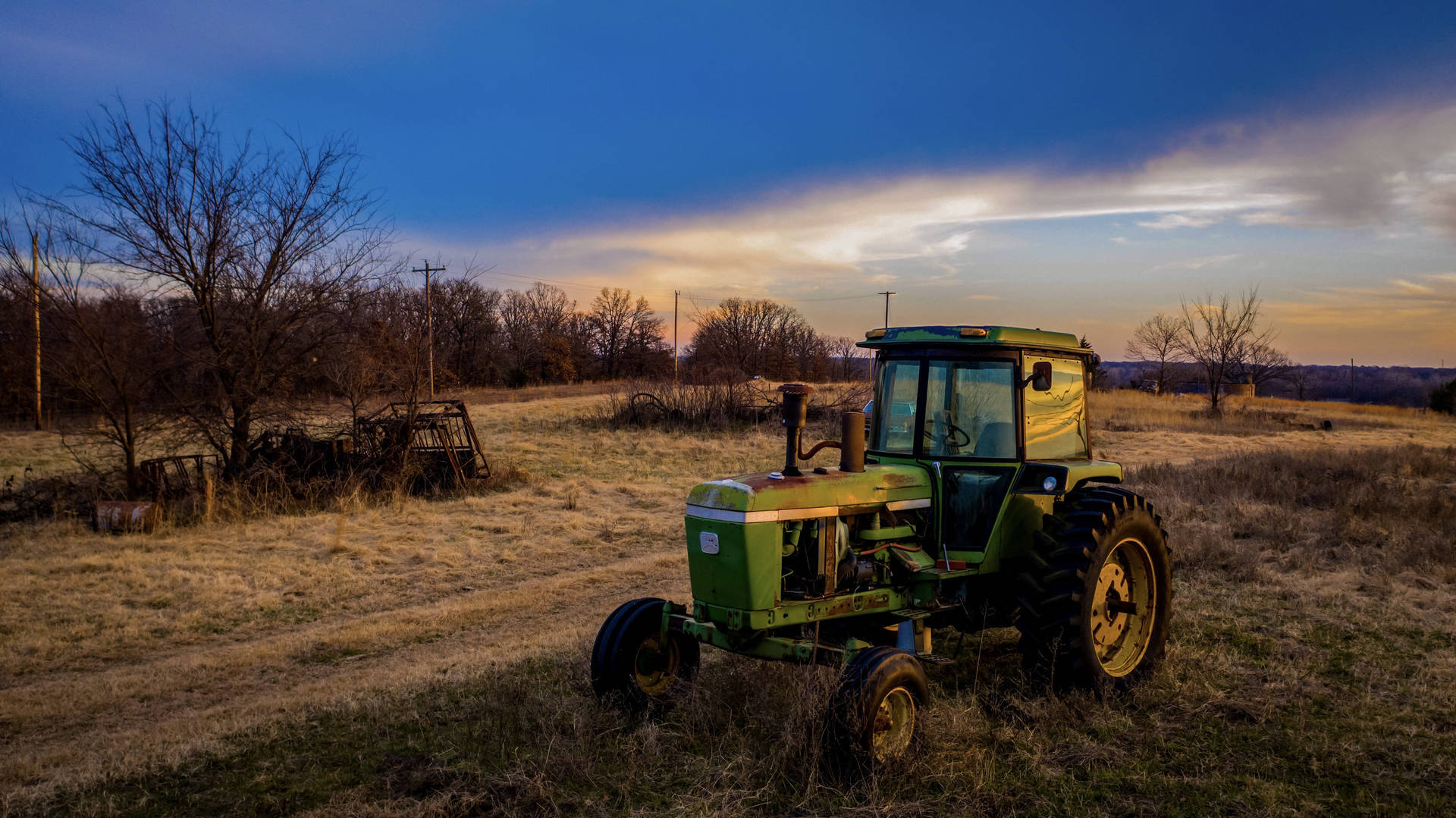 vintage green tractor, dry grassy field, dramatic twilight sky, Full HD Desktop Wallpaper
