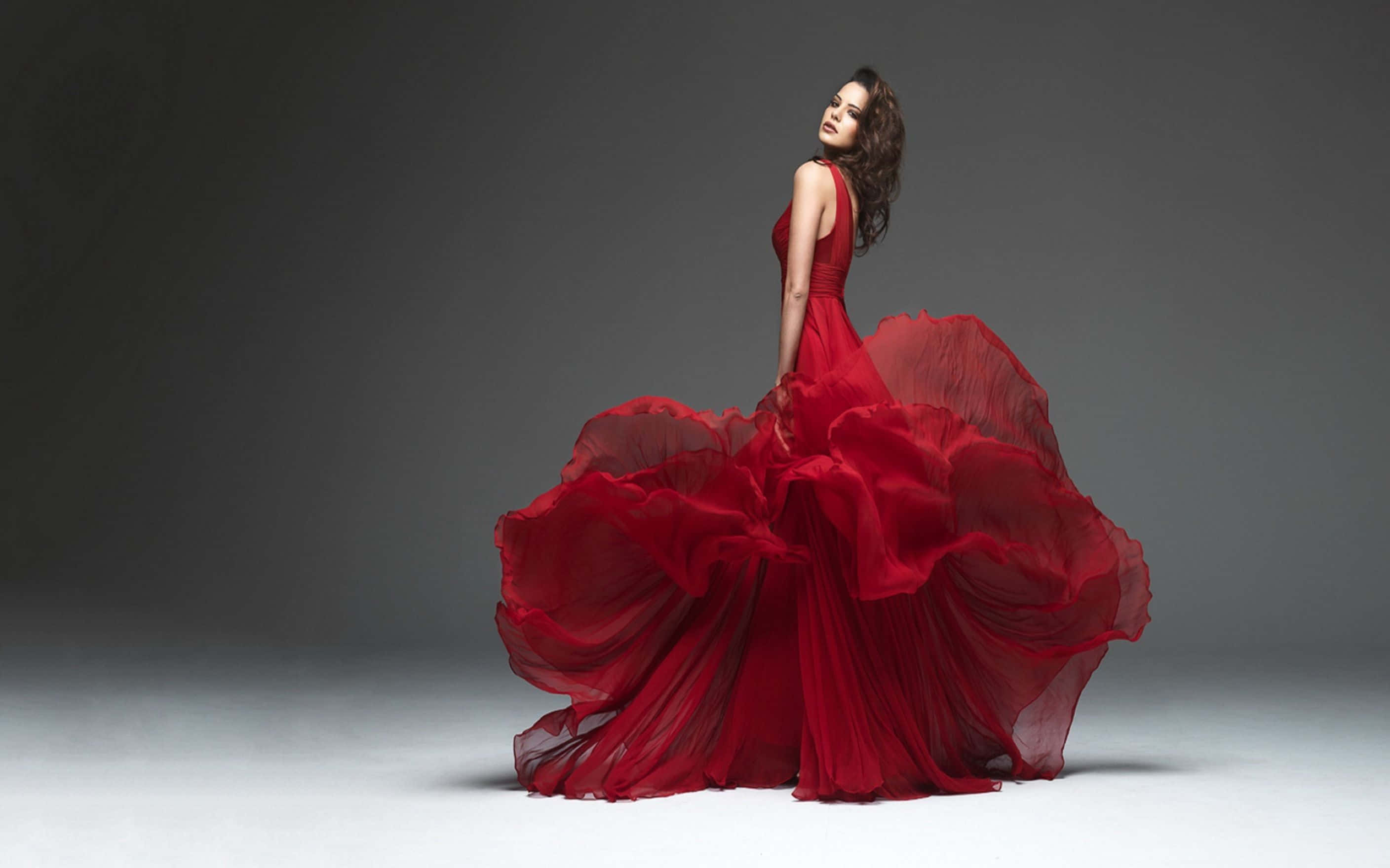 elegant red gown, flowing fabric, minimalist gray and white studio backdrop, 2K Desktop Wallpaper