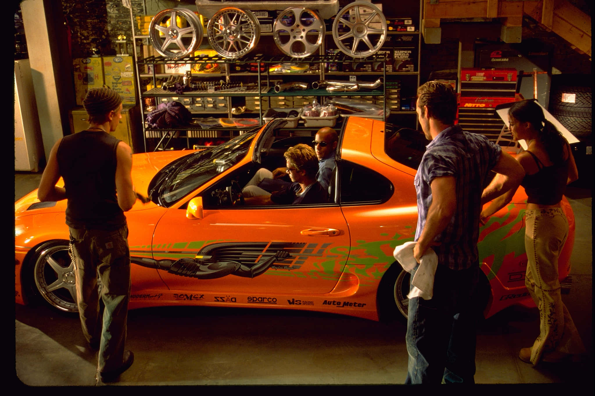 Fast And Furious 1, vibrant orange race car, cluttered garage, Full HD Desktop Wallpaper