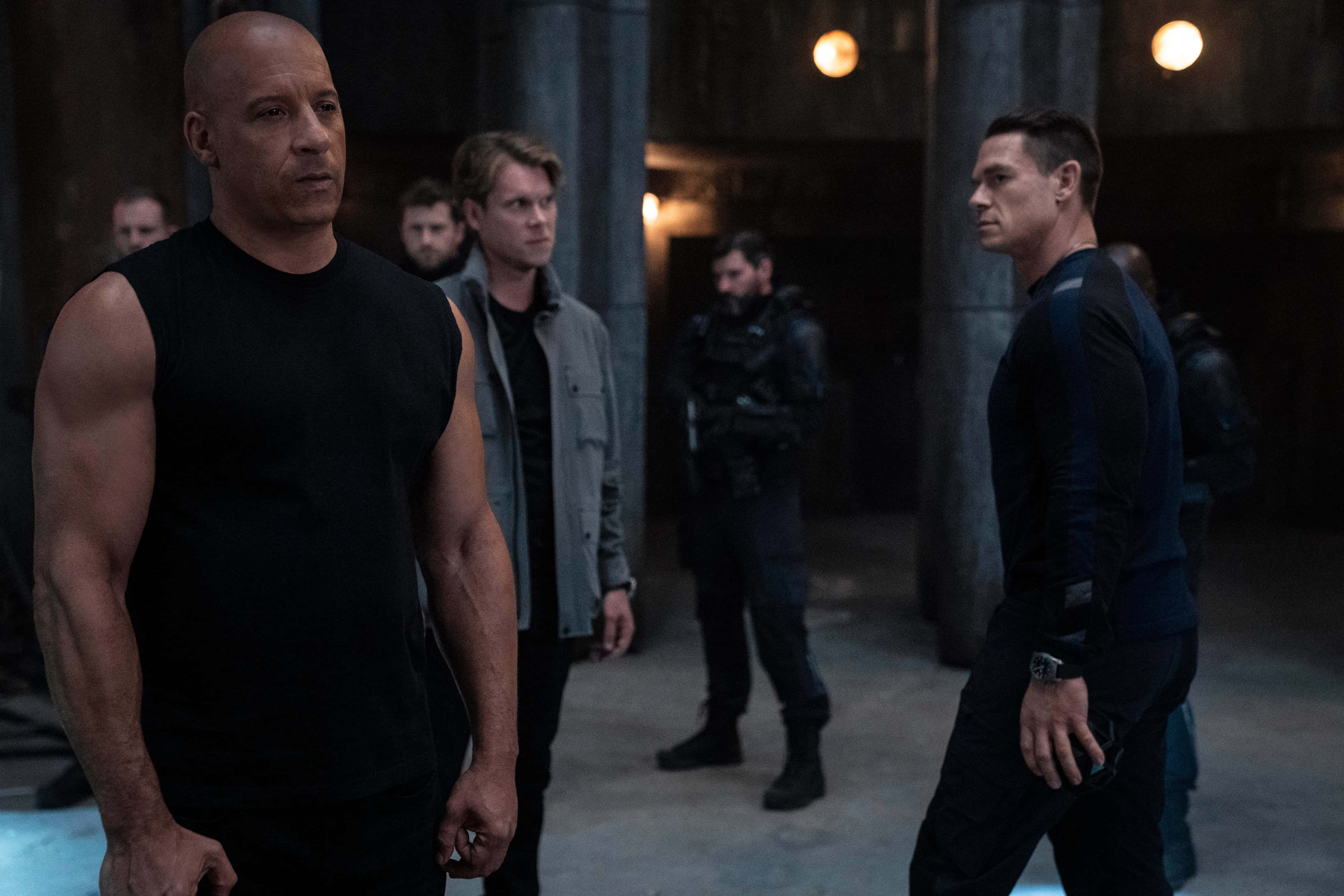 Fast and Furious 9, dimly lit industrial space, warm overhead lights, 4K Desktop Wallpaper