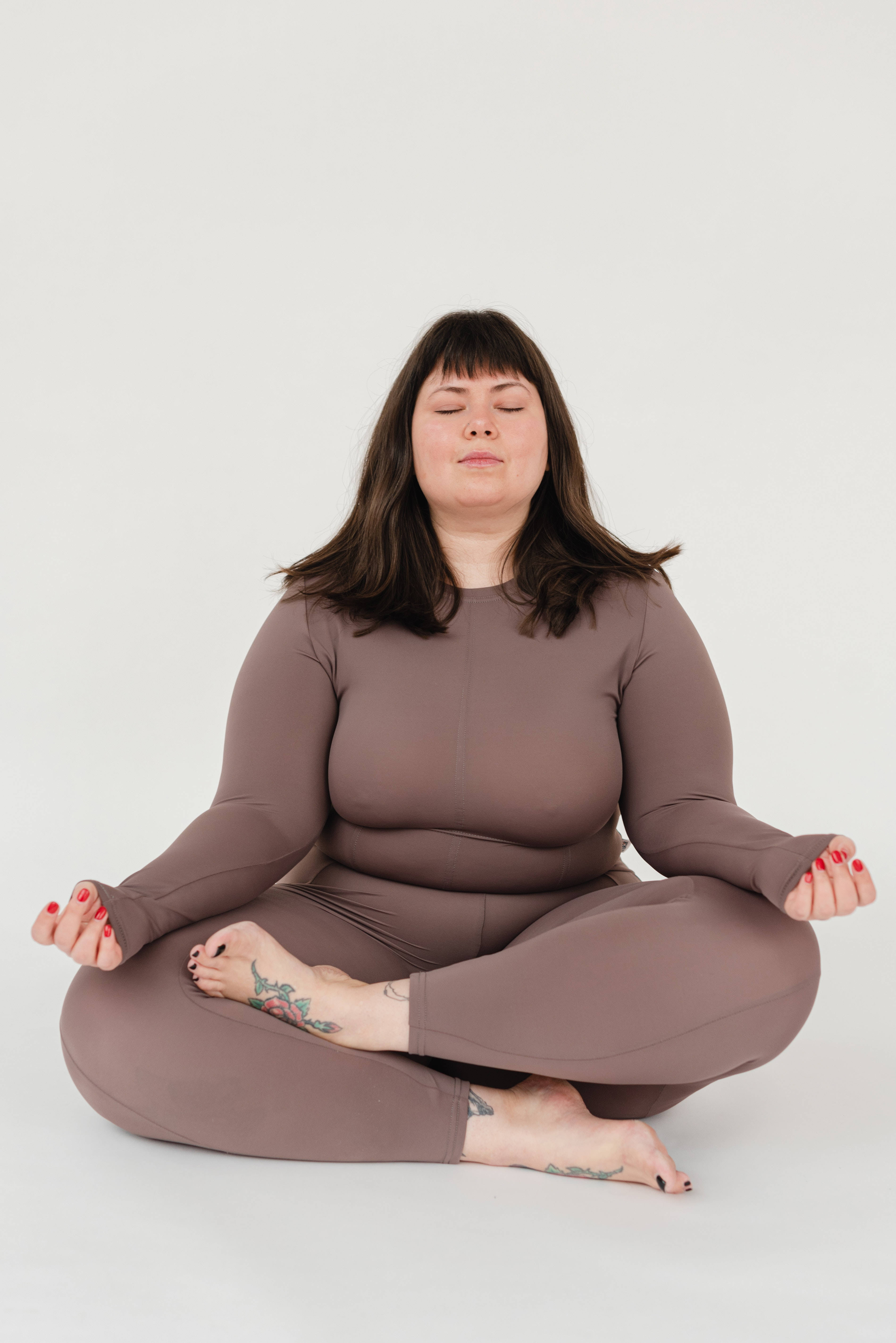 fat woman, brown loungewear, cross-legged, 5K Phone Wallpaper