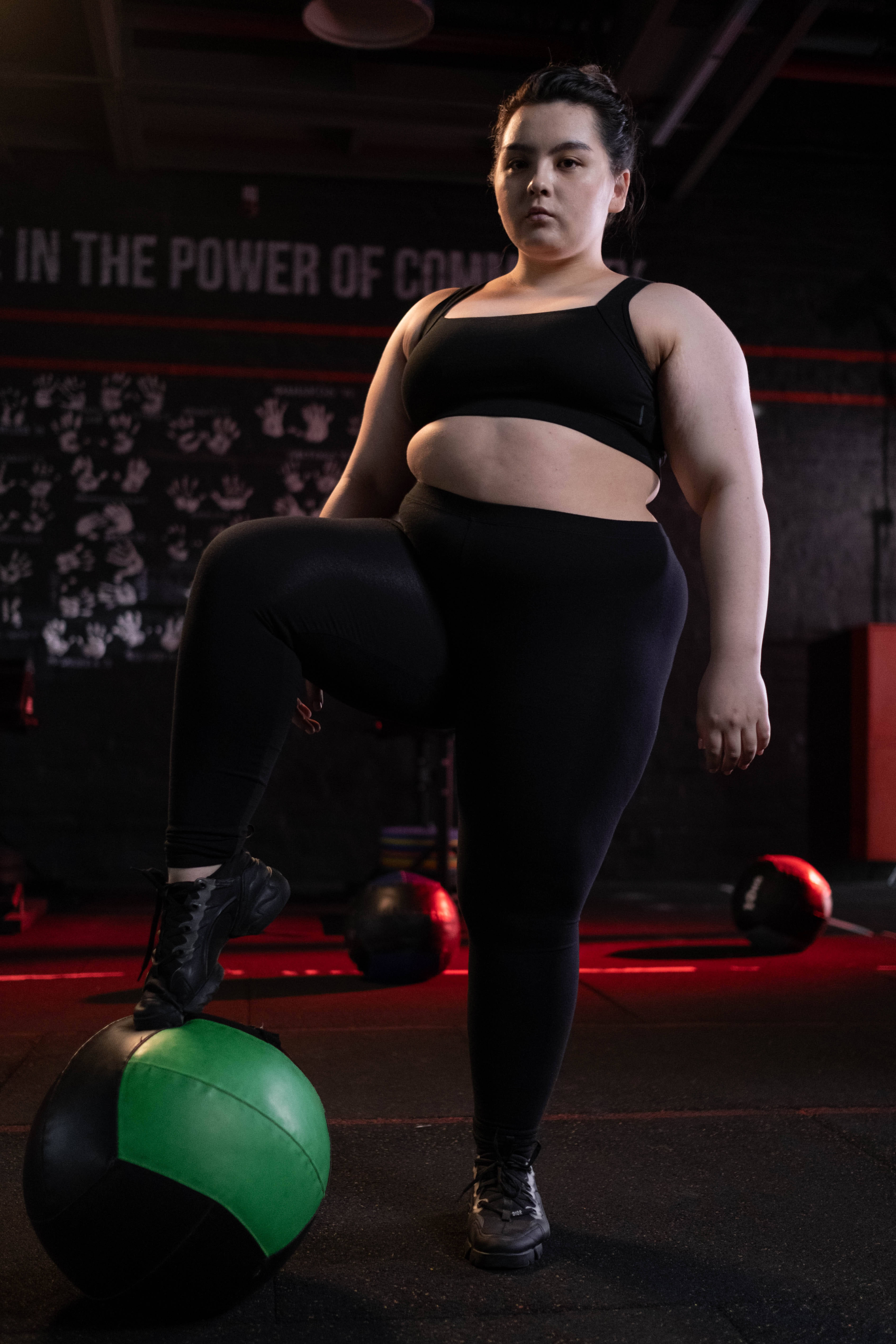 black workout gear, green and black medicine ball, dimly lit gym, 5K Phone Wallpaper