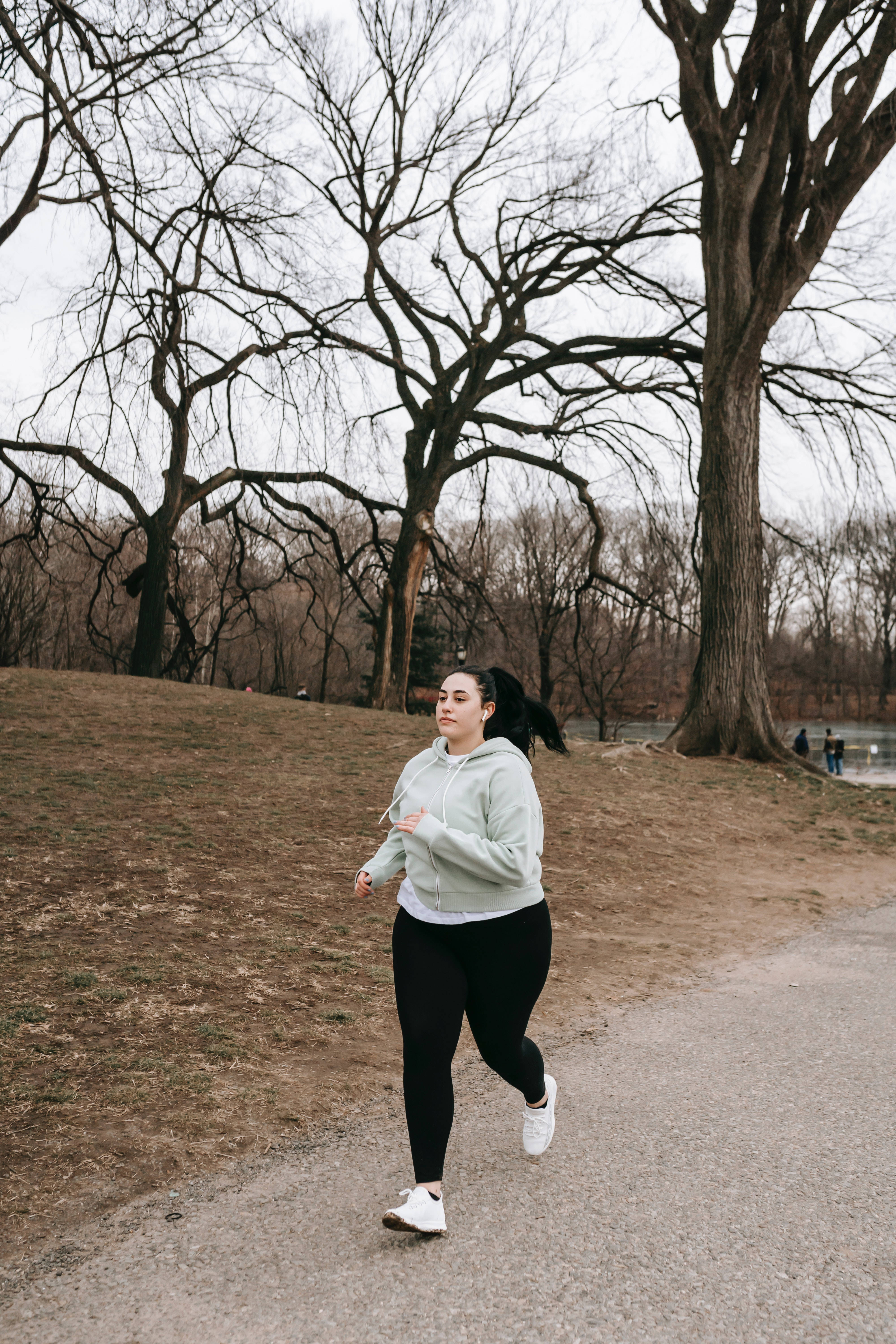 Fat Woman, light green hoodie, park path, 5K Phone Wallpaper