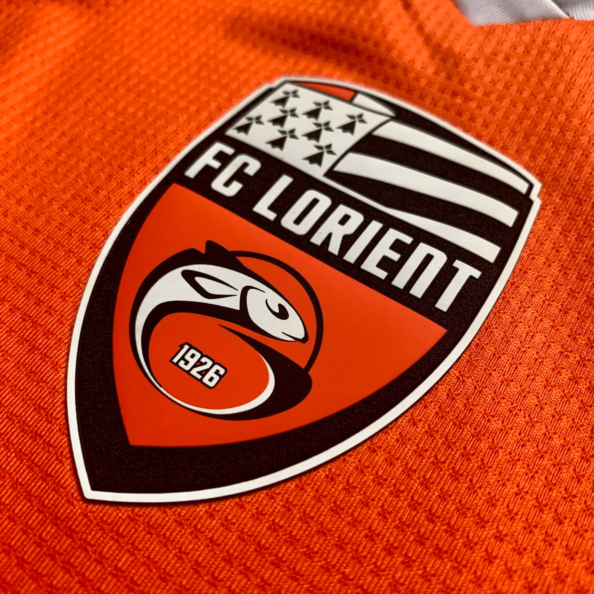 FC Lorient, black white and orange crest, orange textured soccer jersey, Full HD Desktop Wallpaper