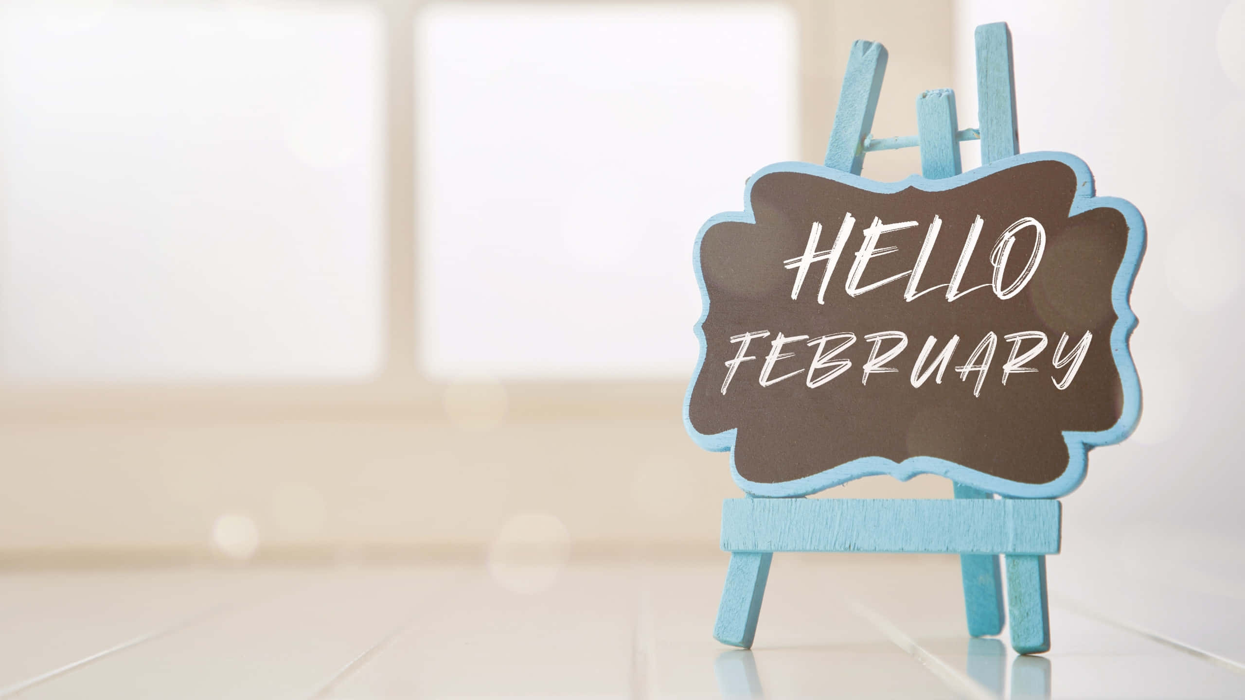 Hello February Signon Easel, light blue easel, chalkboard sign, 2K Desktop Wallpaper
