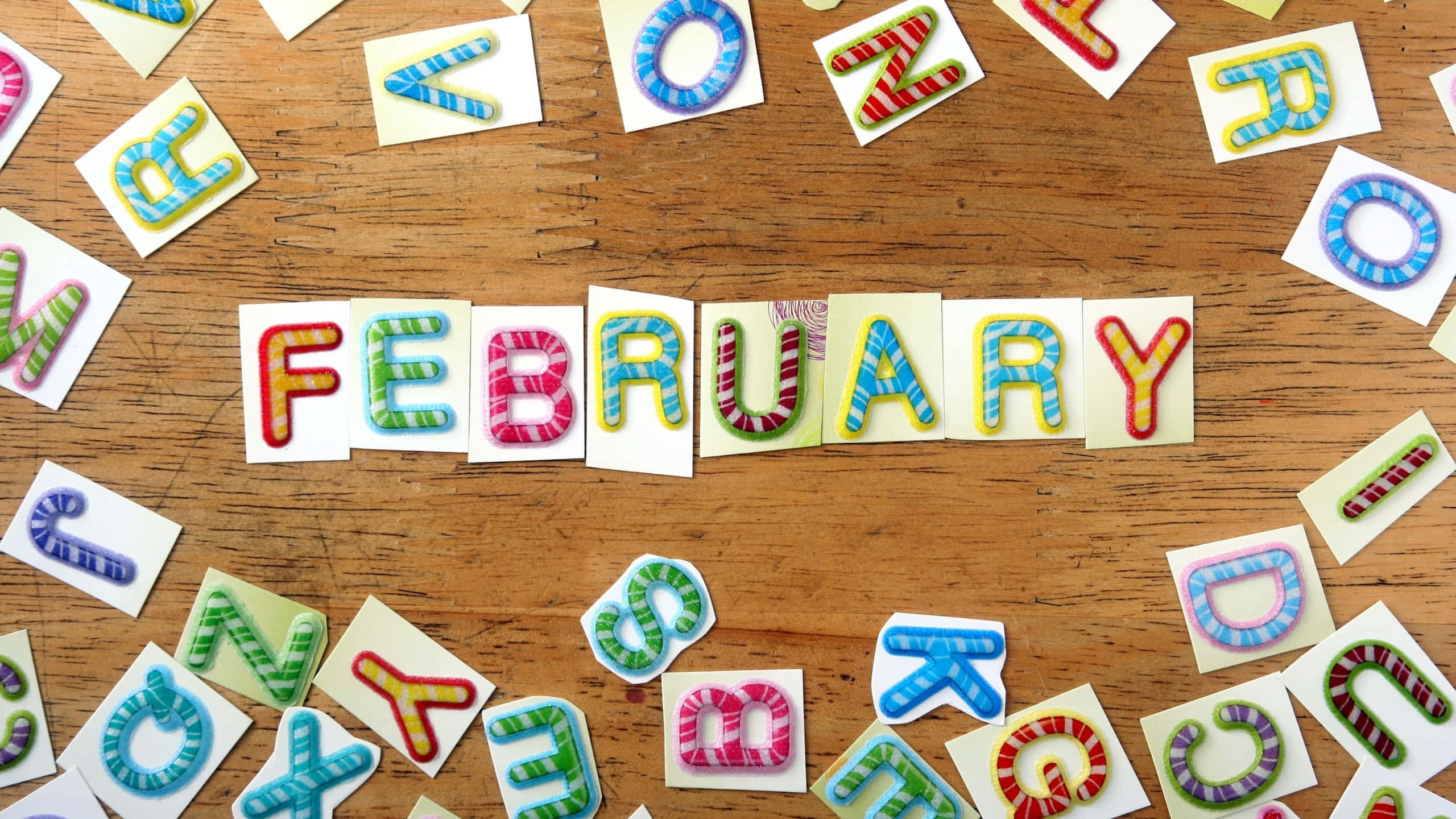 FEBRUARY, candy cane styled letters, rustic wooden table, 2K Desktop Wallpaper