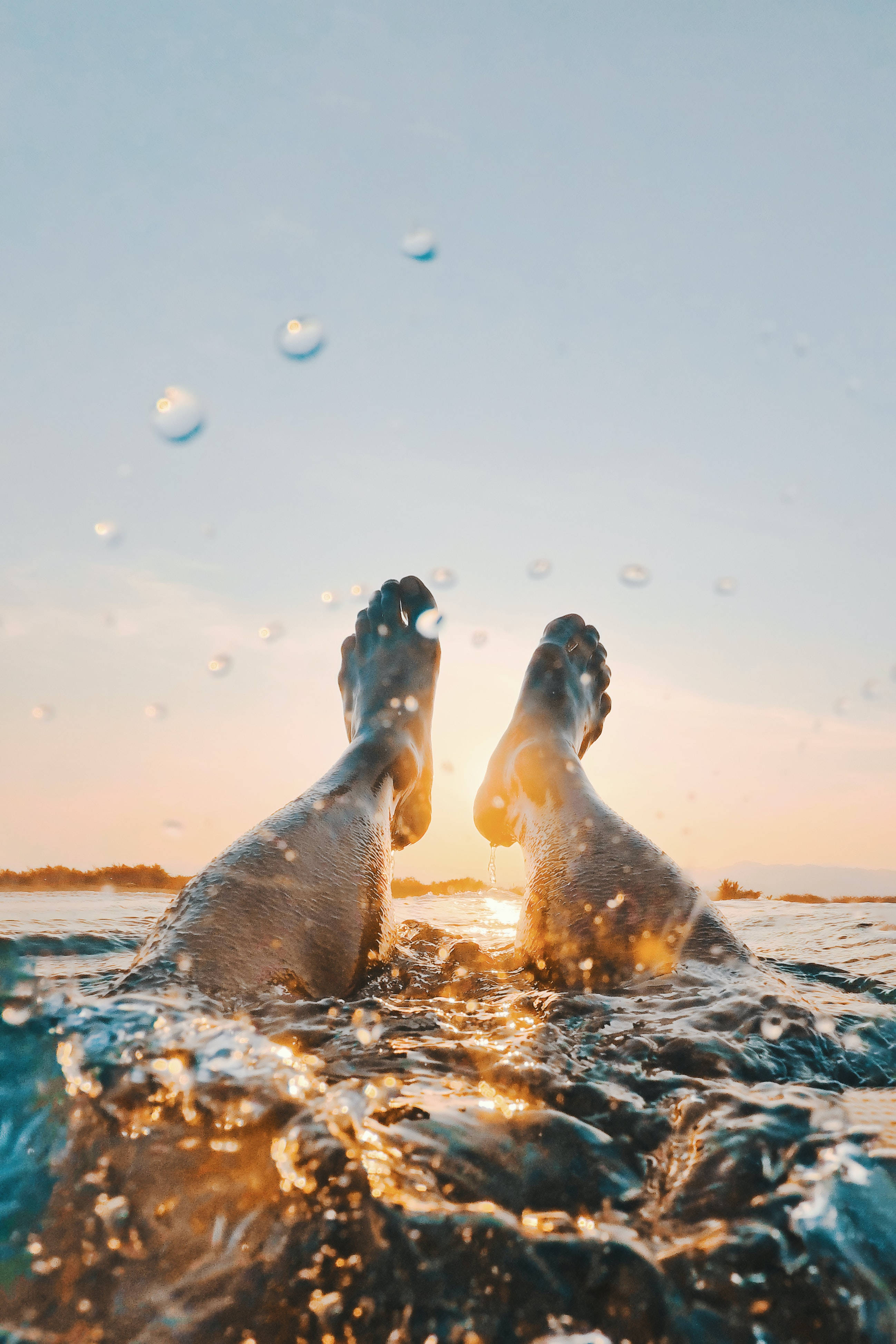 feet, vast ocean, golden sunset sky, 4K Phone Wallpaper