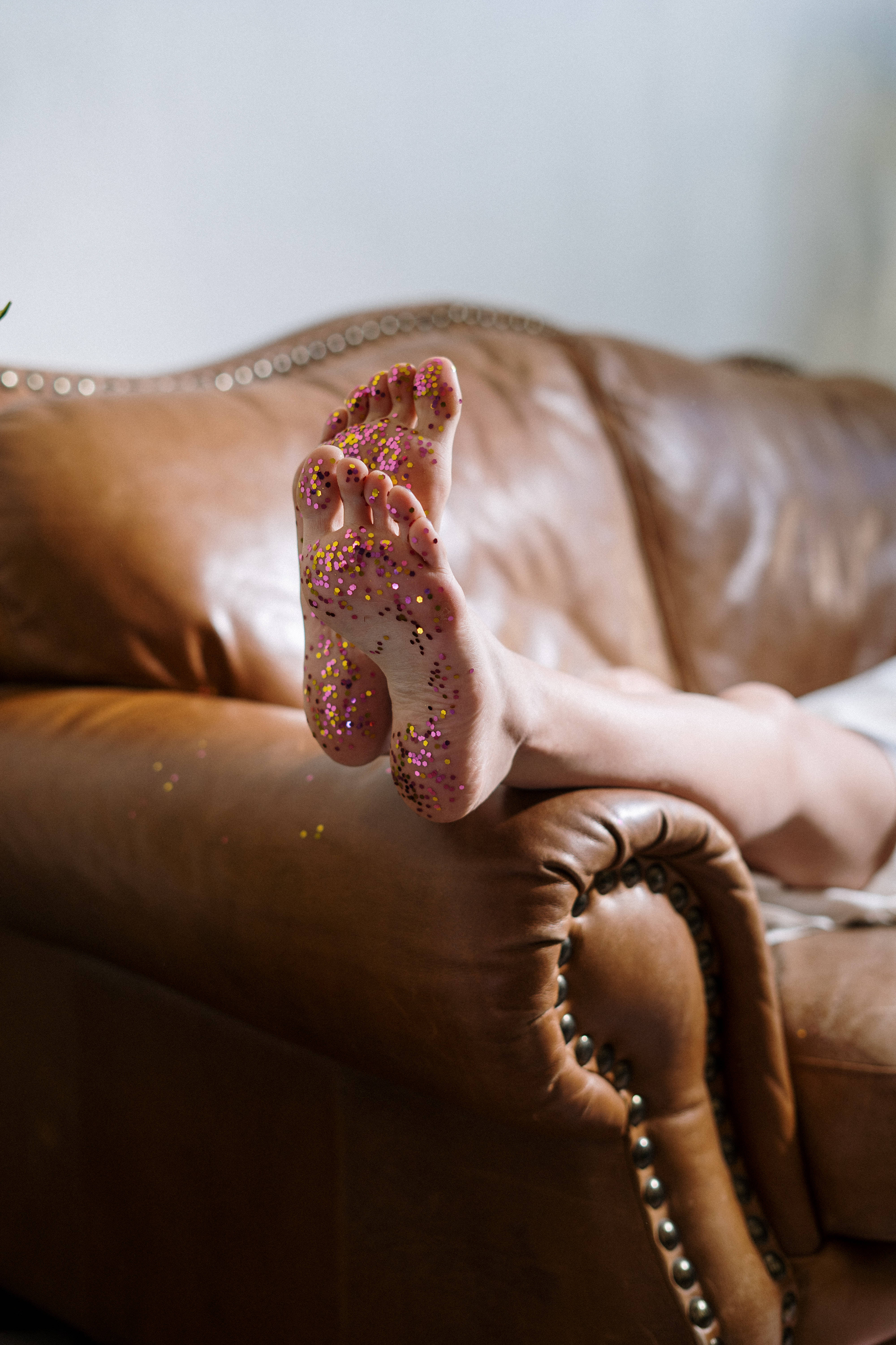 colorful glitters, brown leather couch, nail studs, 5K Phone Wallpaper