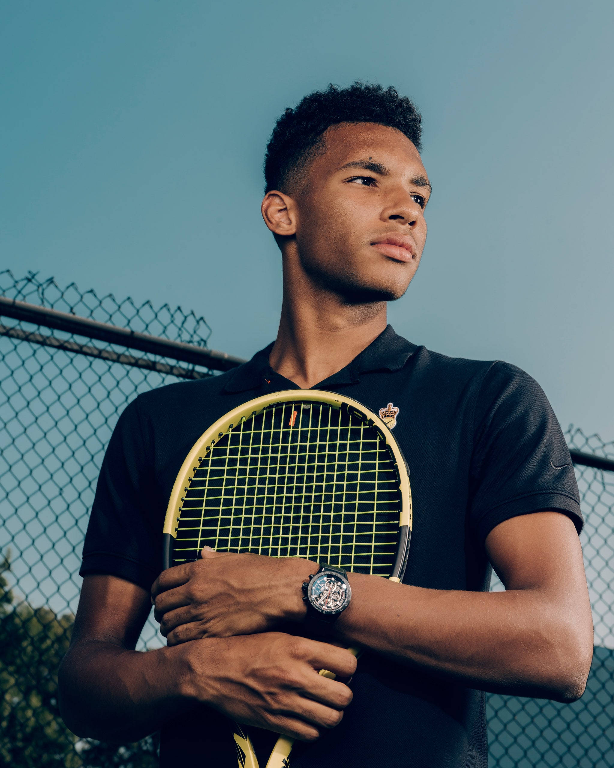 Felix Auger Aliassime, yellow racket, chain-link fence, 2K Phone Wallpaper