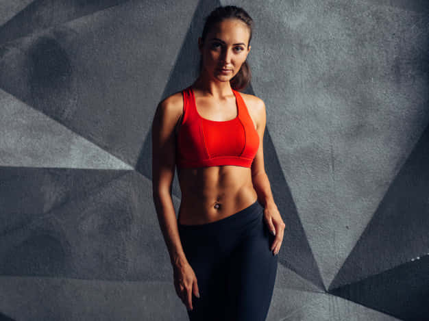 red sports bra, black leggings, geometrically shadowed gray wall, SD Desktop Wallpaper