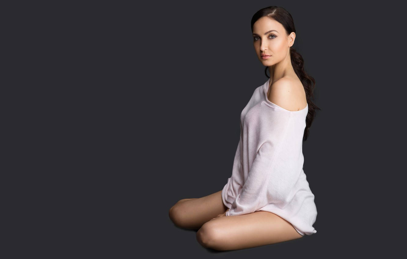 white top, dark gray studio background, cross-legged, HD Desktop Wallpaper