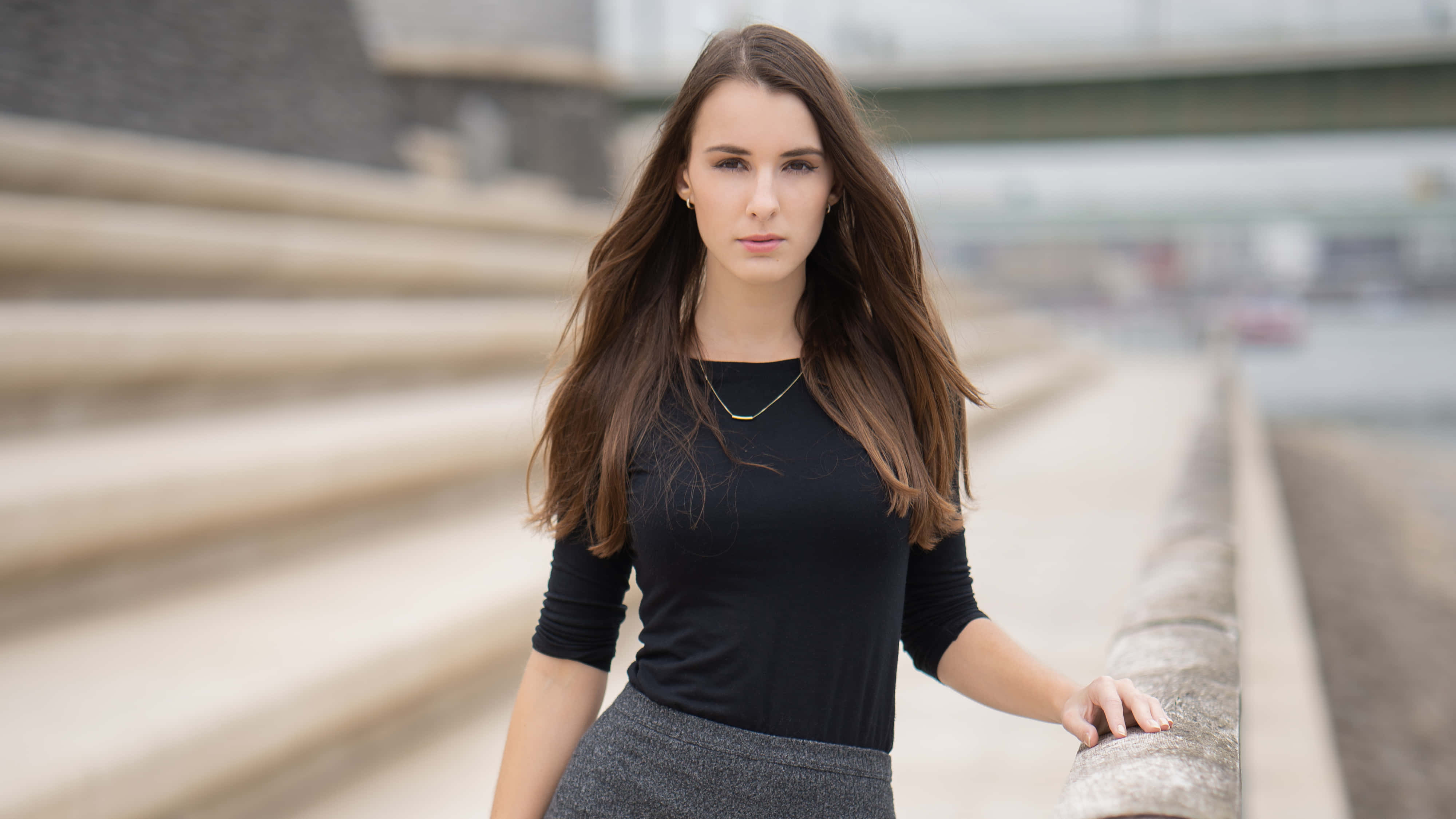 young woman, long brown hair, urban concrete steps, 4K Desktop Wallpaper