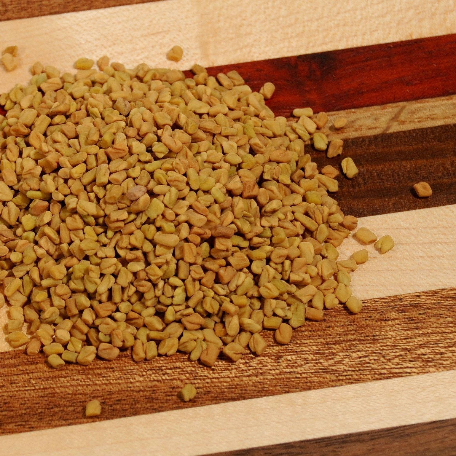 fenugreek seeds, striped wooden cutting board, warm natural tones, HD Desktop Wallpaper
