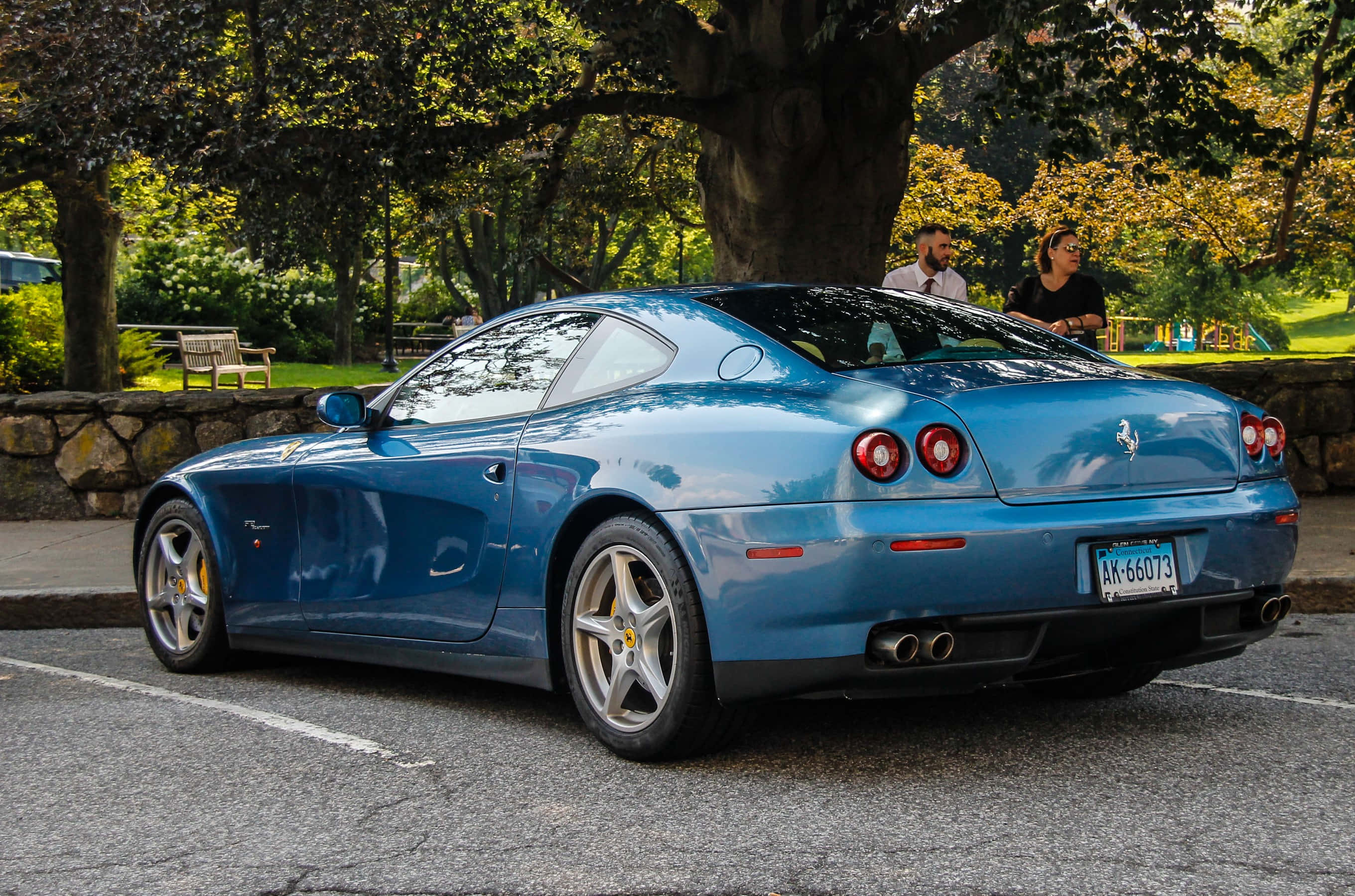 Ferrari 612 Scaglietti, blue, tree-lined park, 2K Desktop Wallpaper