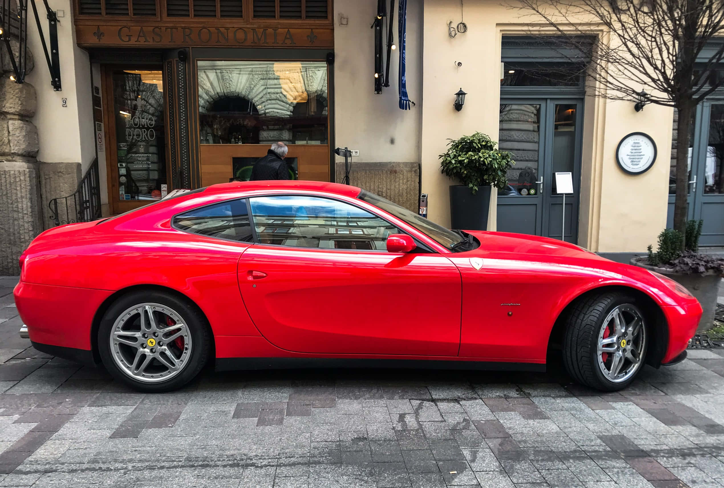 Ferrari 612 Scaglietti, vibrant red, wet cobblestone street, Full HD Desktop Wallpaper